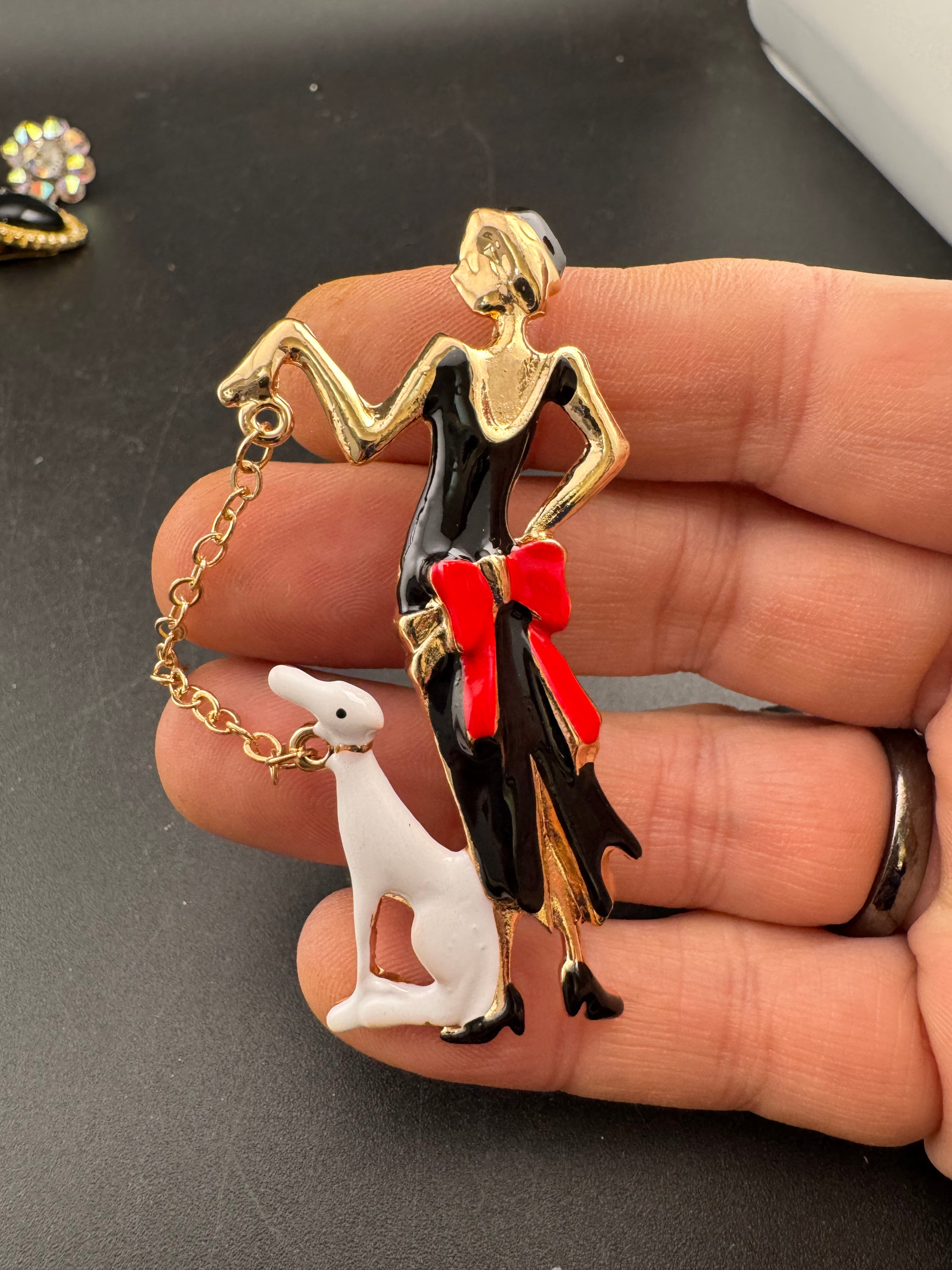 art deco lady with a dog on a lead brooch