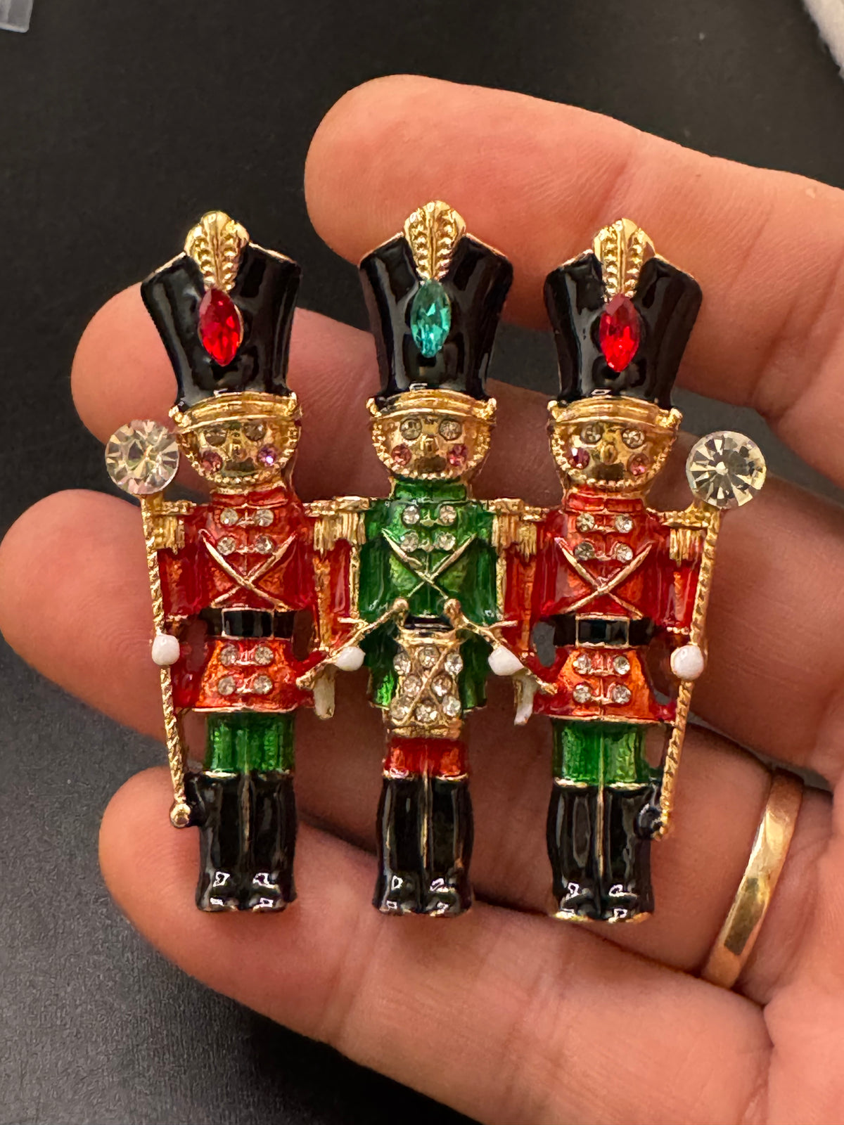 Novelty diamanté nutcracker soldier enamel brooch, red and gold enamel, festive jewellery