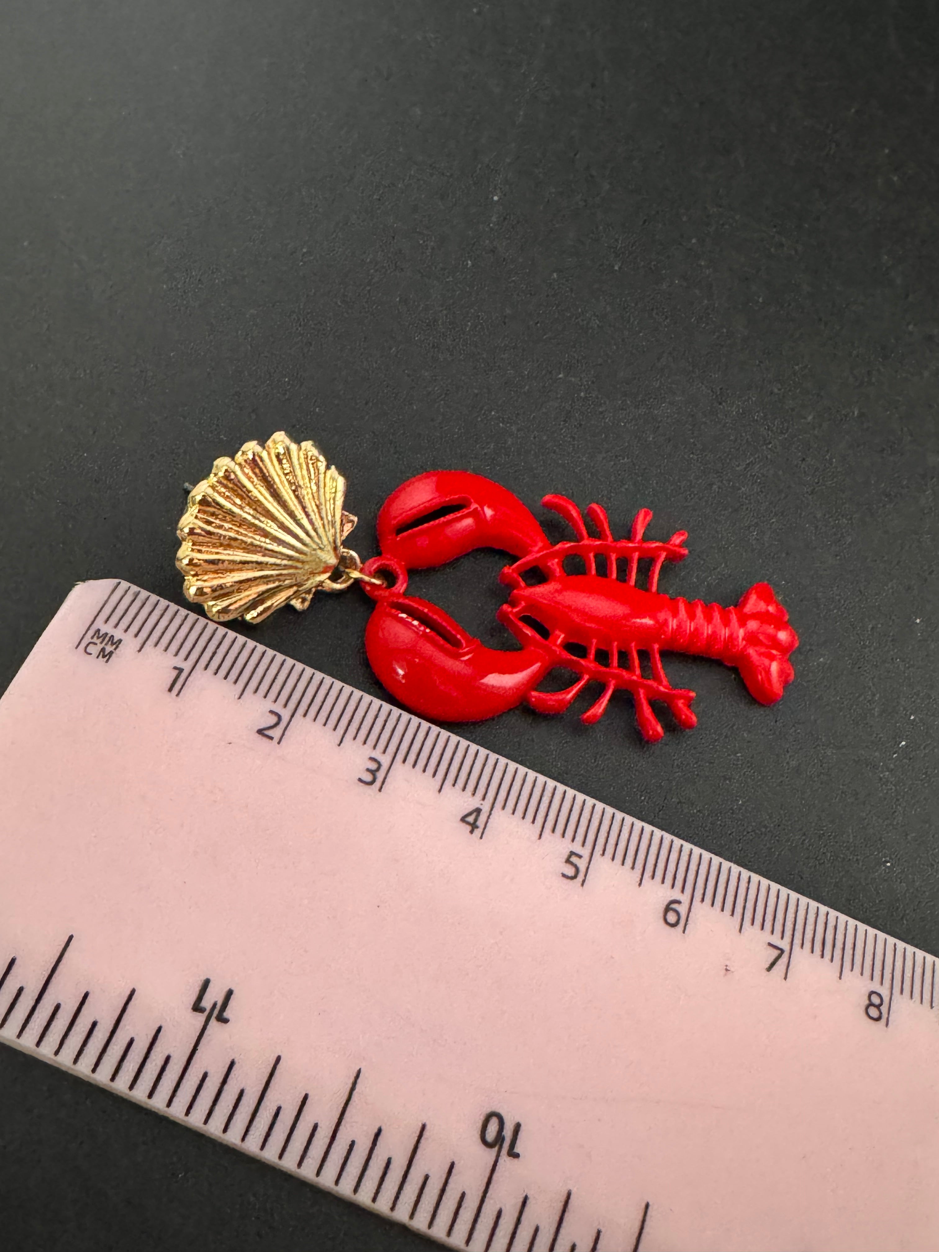 Bright red enamel lobster dangly earrings with gold seashells