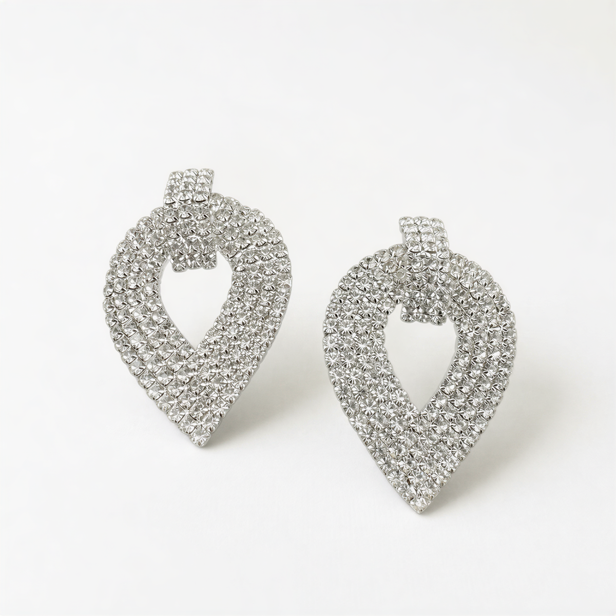 A pair of elegant silver earrings with a sparkling crystal design.