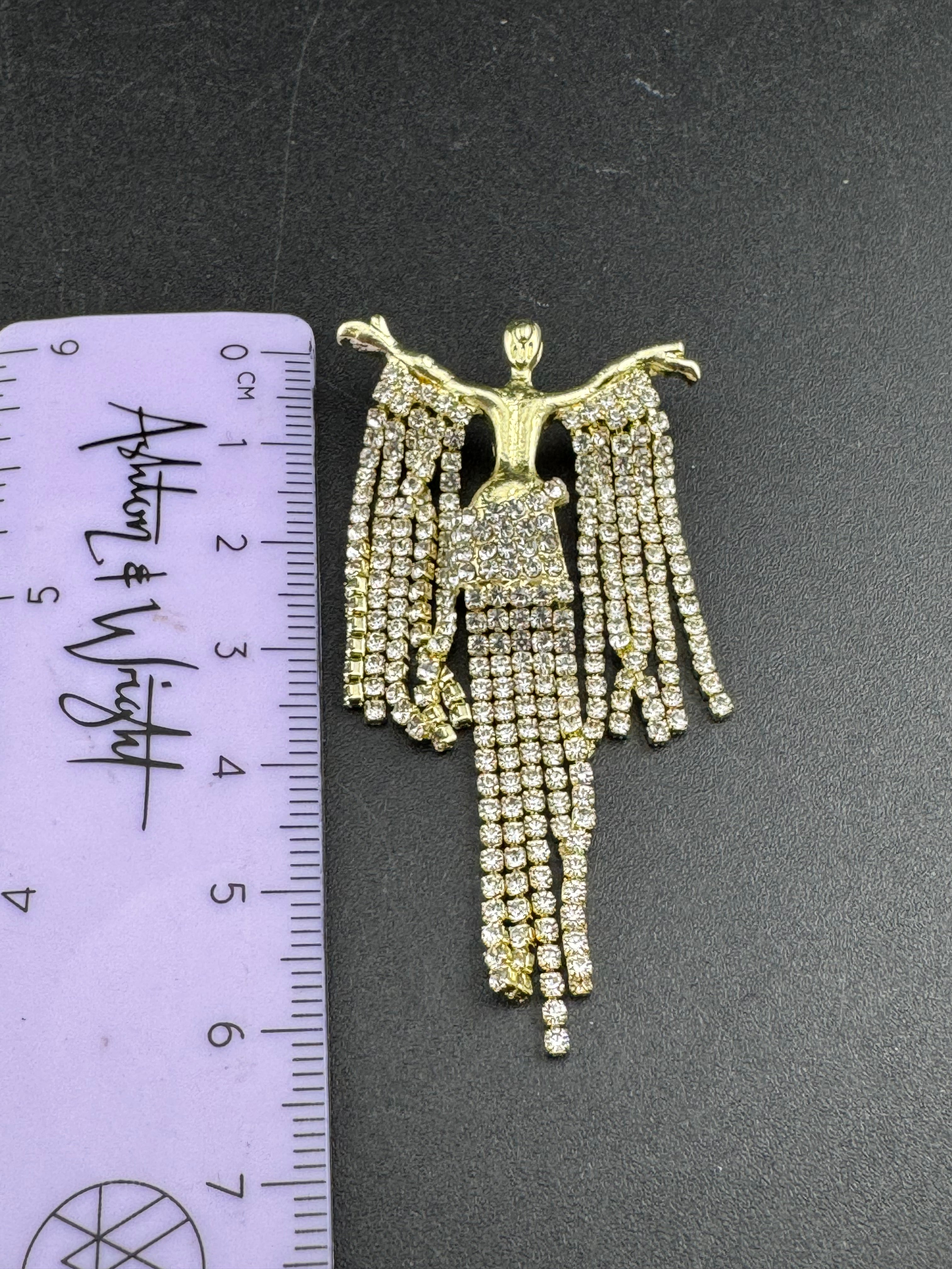 Gold rhinestone diva brooch, diamanté lady waterfall pin