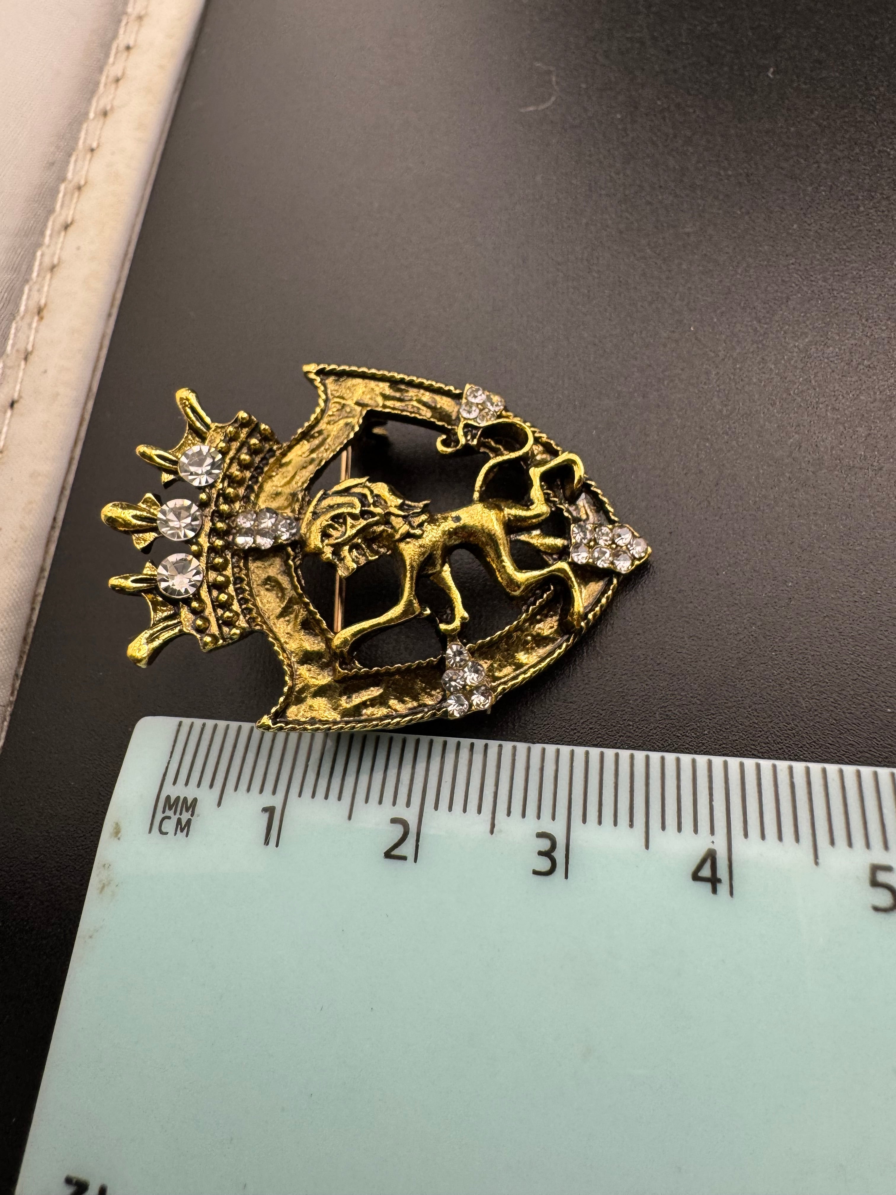 Crystal rampant lion shield brooch, antique gold tone