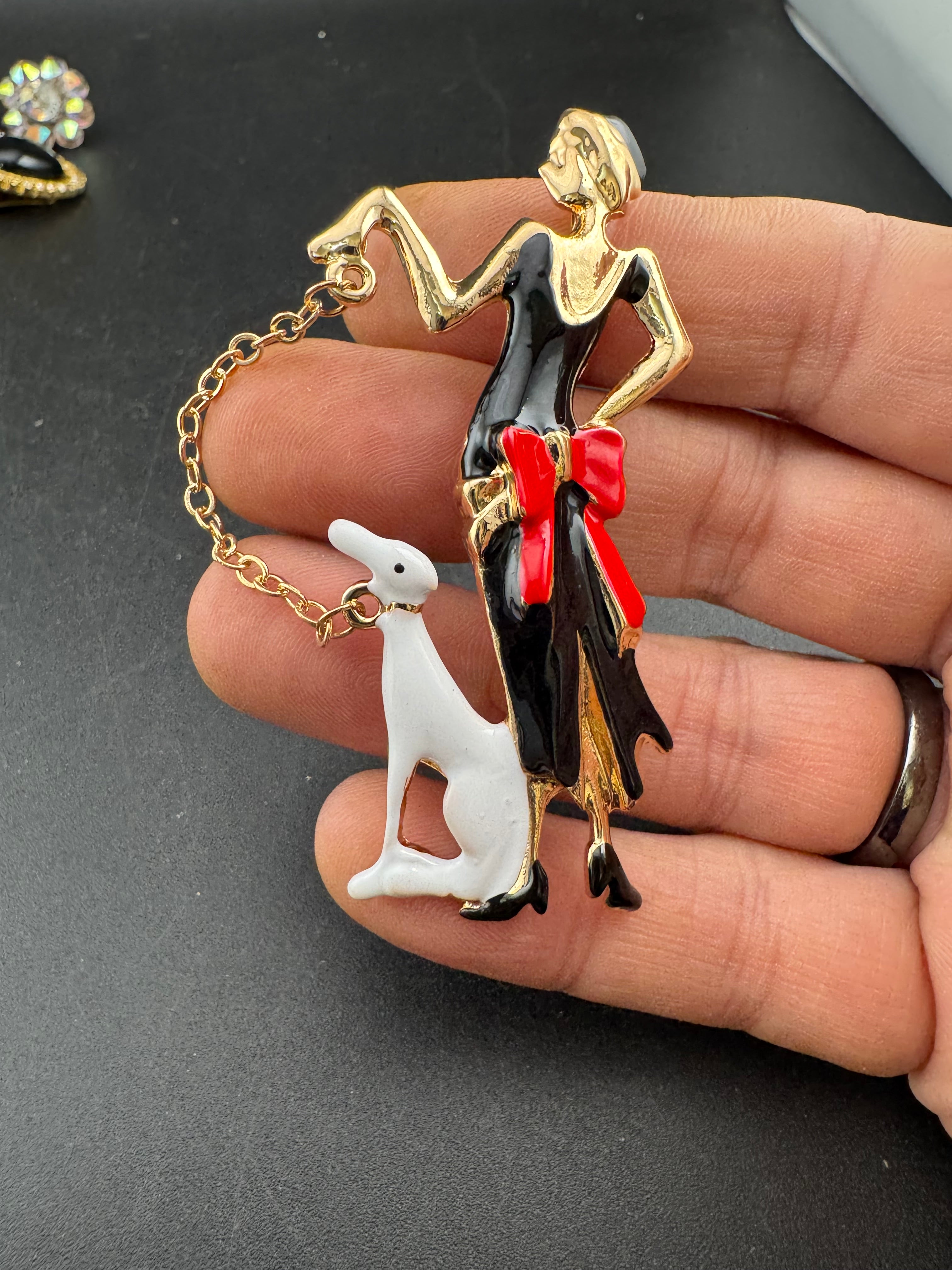 art deco lady with a dog on a lead brooch