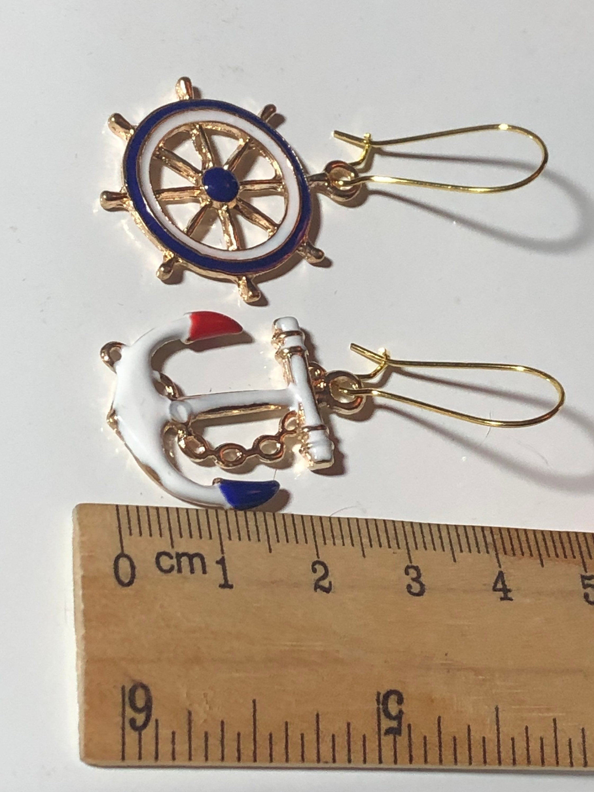 Nautical gold tone white enamel anchor and ships wheel small drop earrings