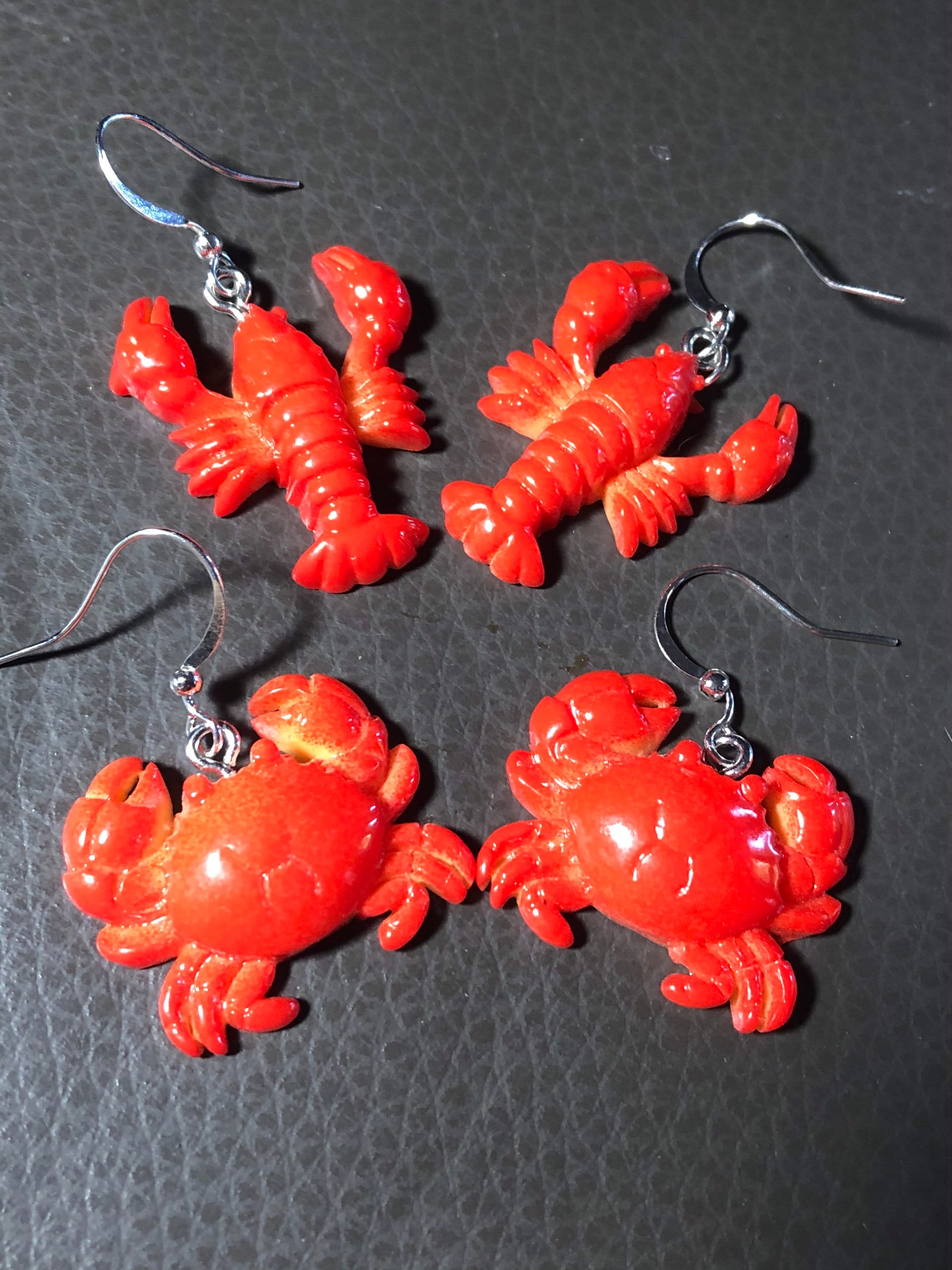 Orange plastic nautical lobster dangly earrings pierced ears