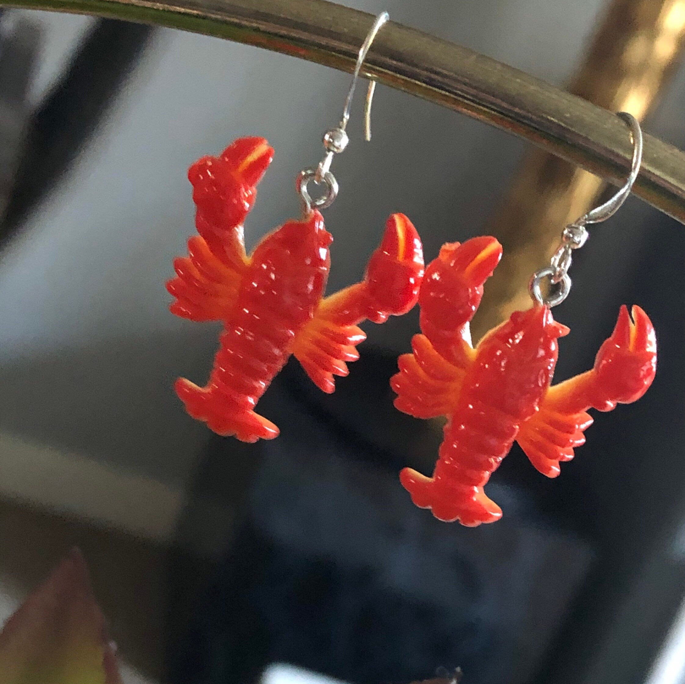 Orange plastic nautical lobster dangly earrings pierced ears