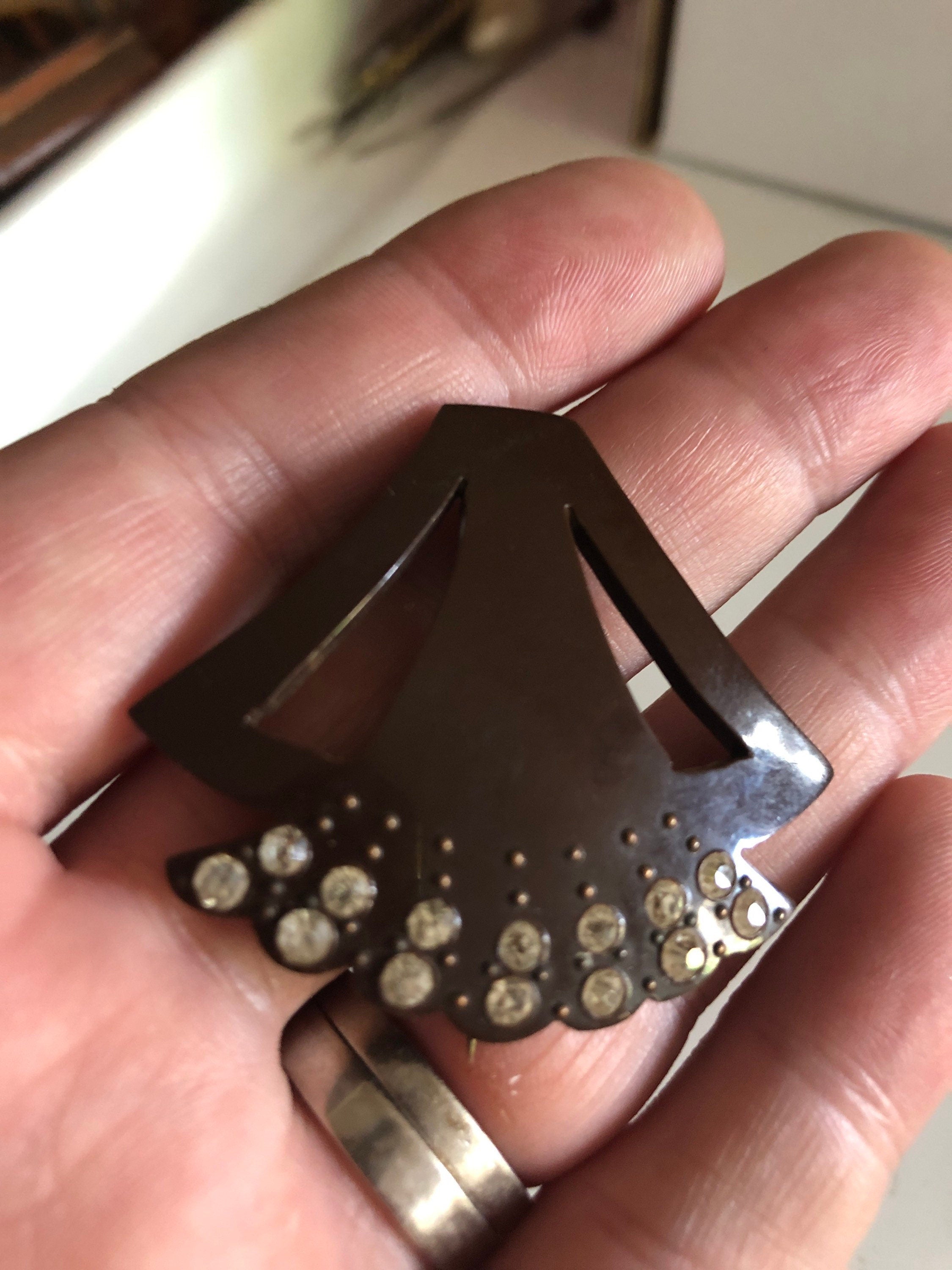 Brown early plastic hat flash pin with rhinestones paste brown pique work bakelite art deco