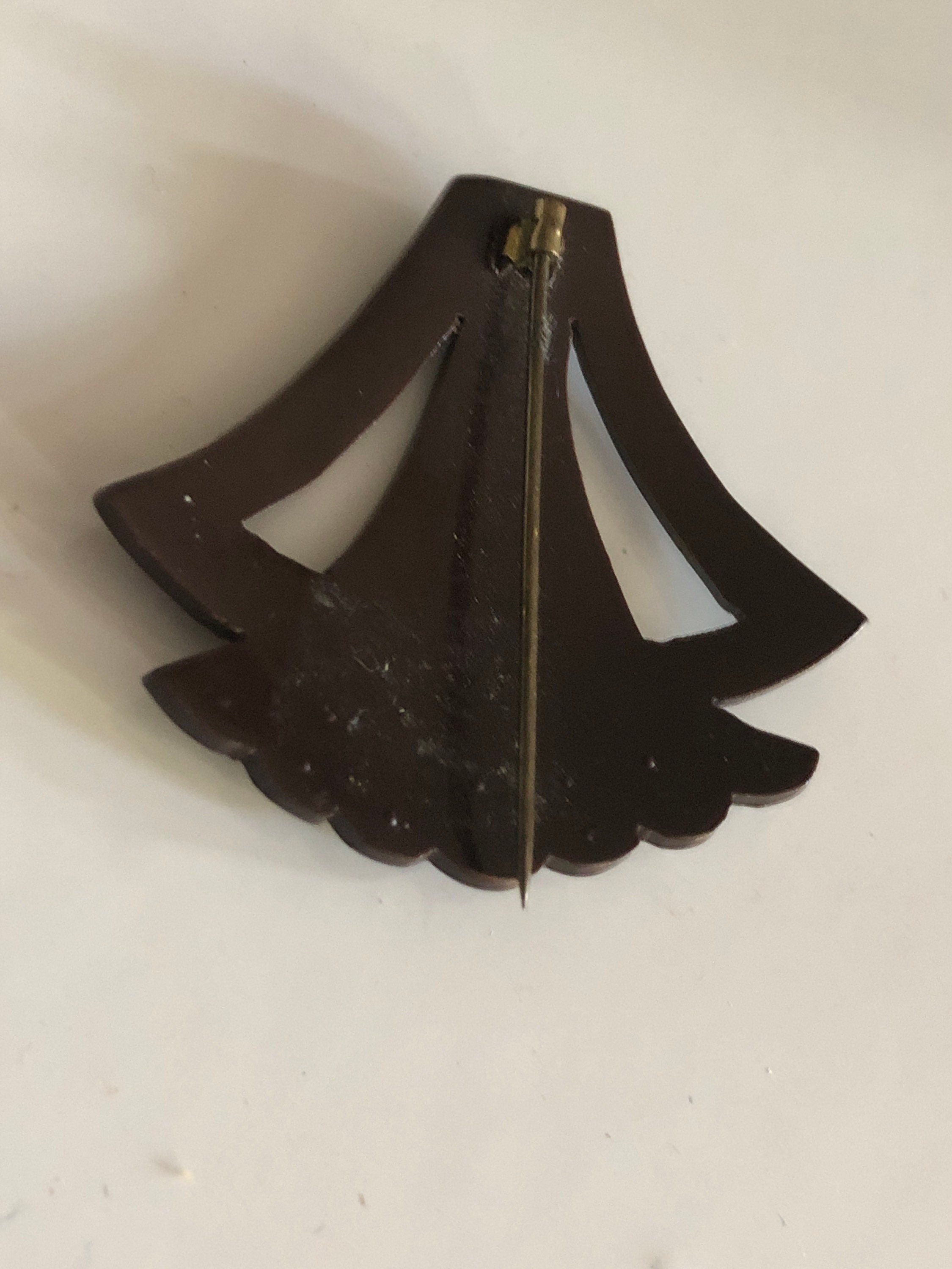 Brown early plastic hat flash pin with rhinestones paste brown pique work bakelite art deco