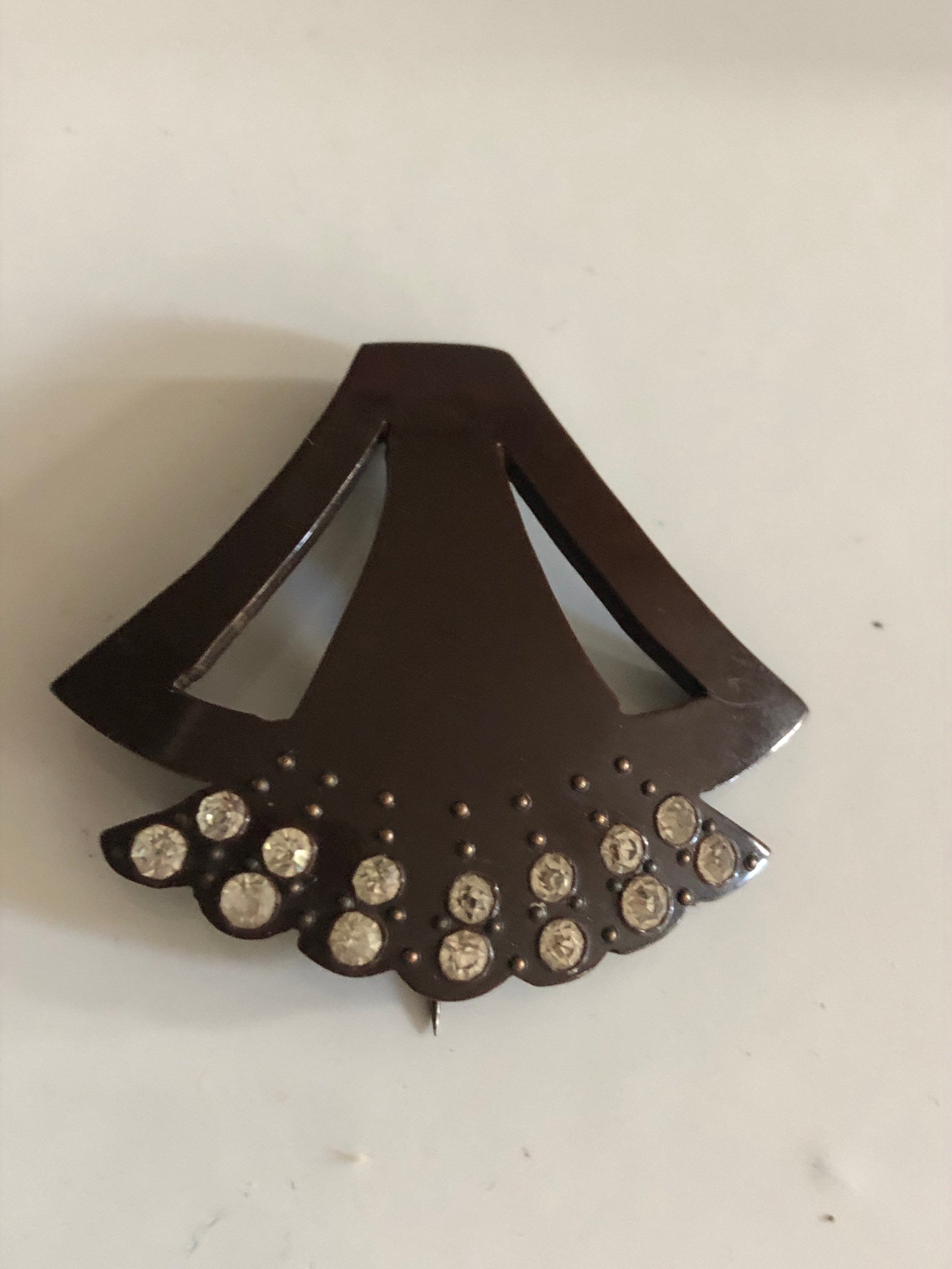 Brown early plastic hat flash pin with rhinestones paste brown pique work bakelite art deco