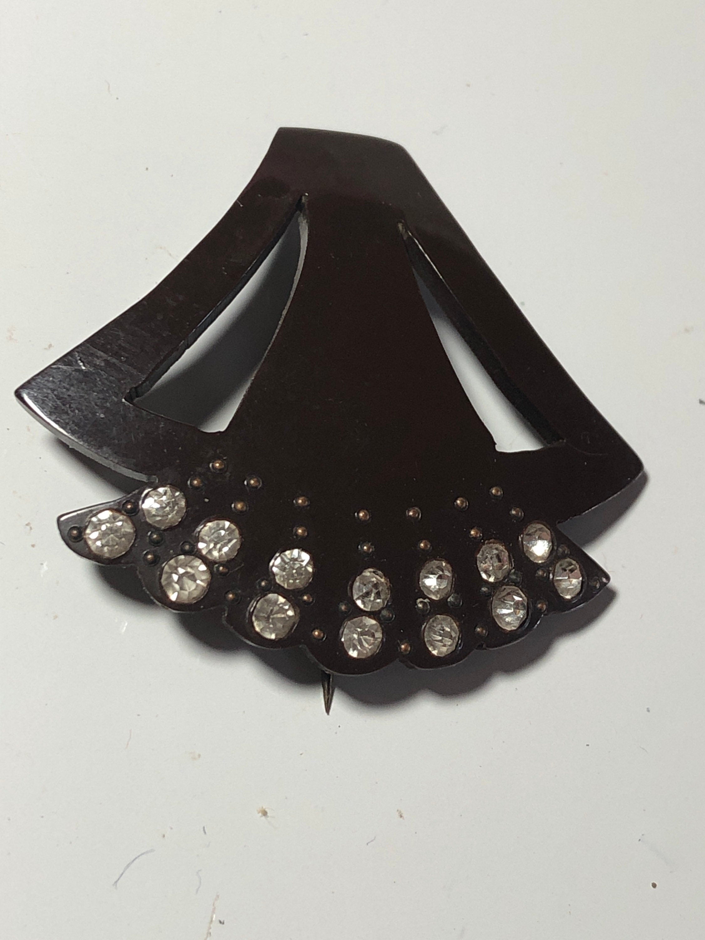 Brown early plastic hat flash pin with rhinestones paste brown pique work bakelite art deco