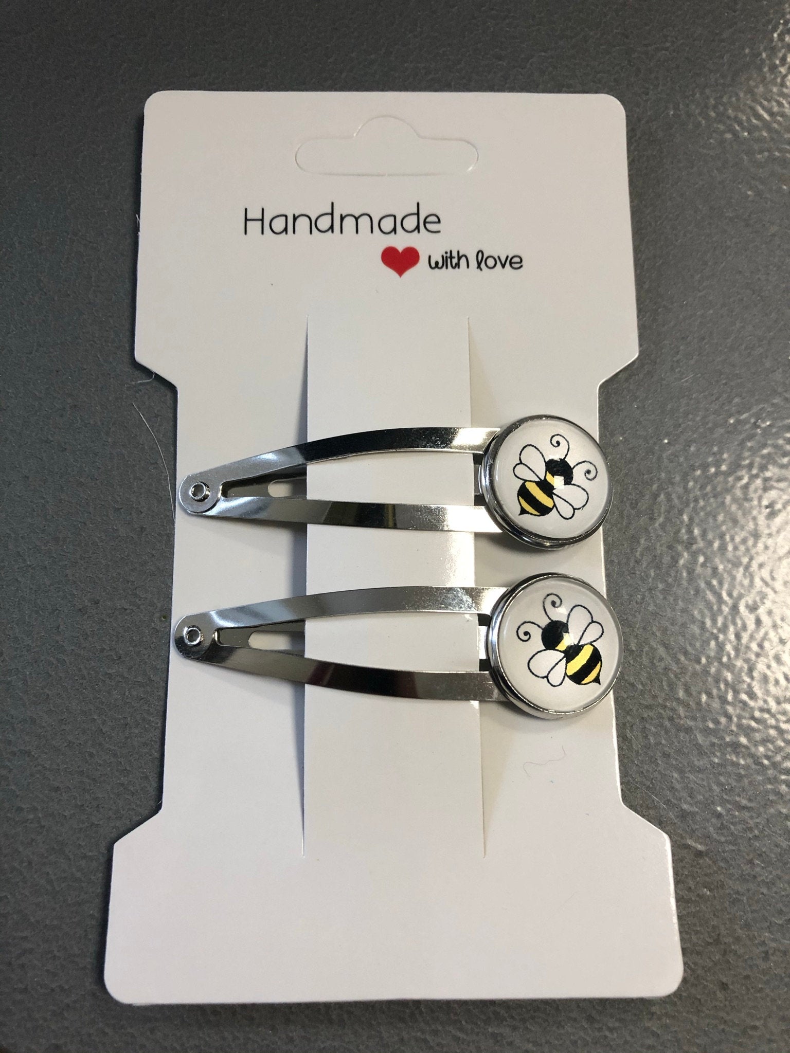 pair of bee hair clips silver tone snap lock closure
