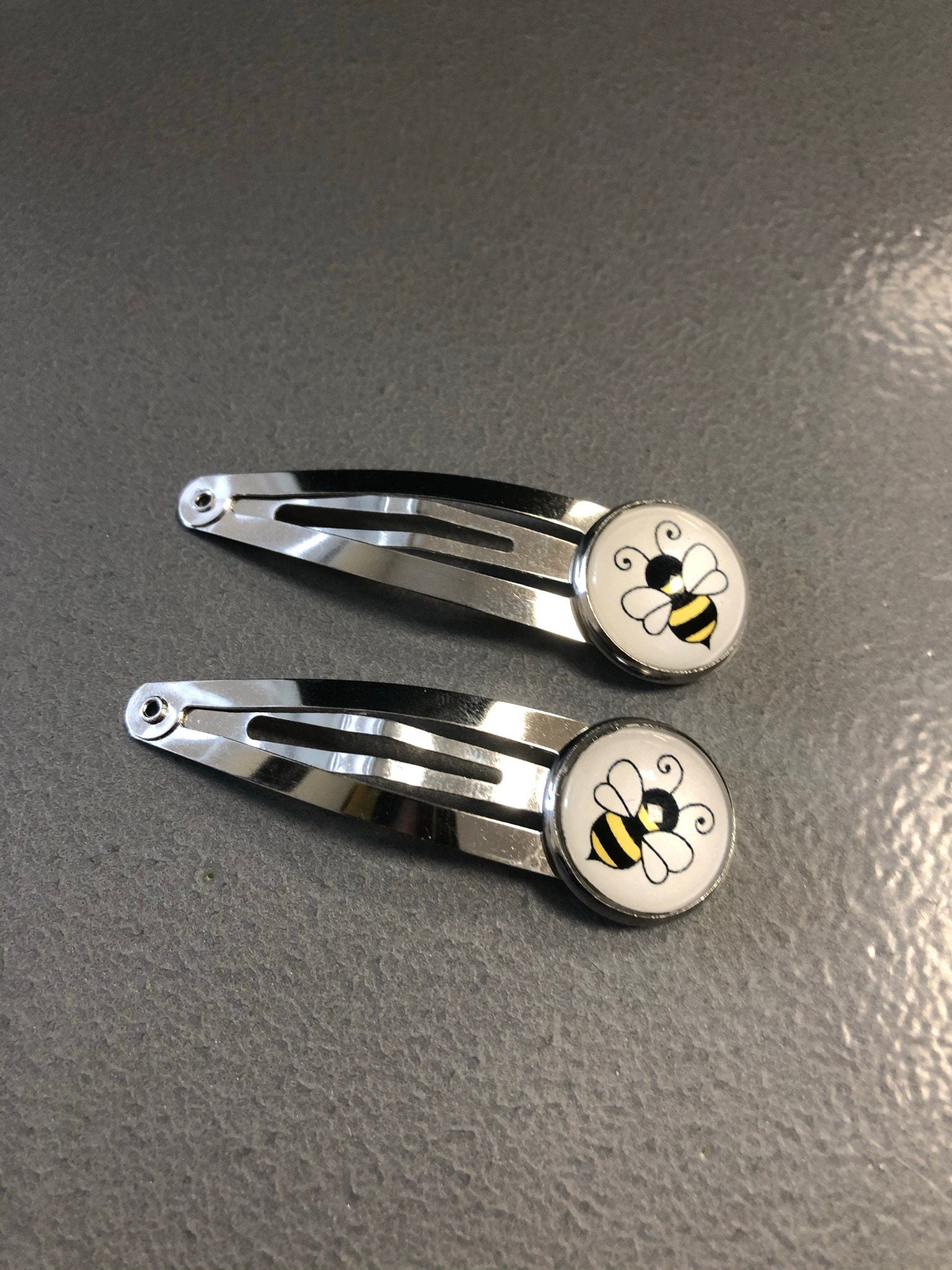 pair of bee hair clips silver tone snap lock closure