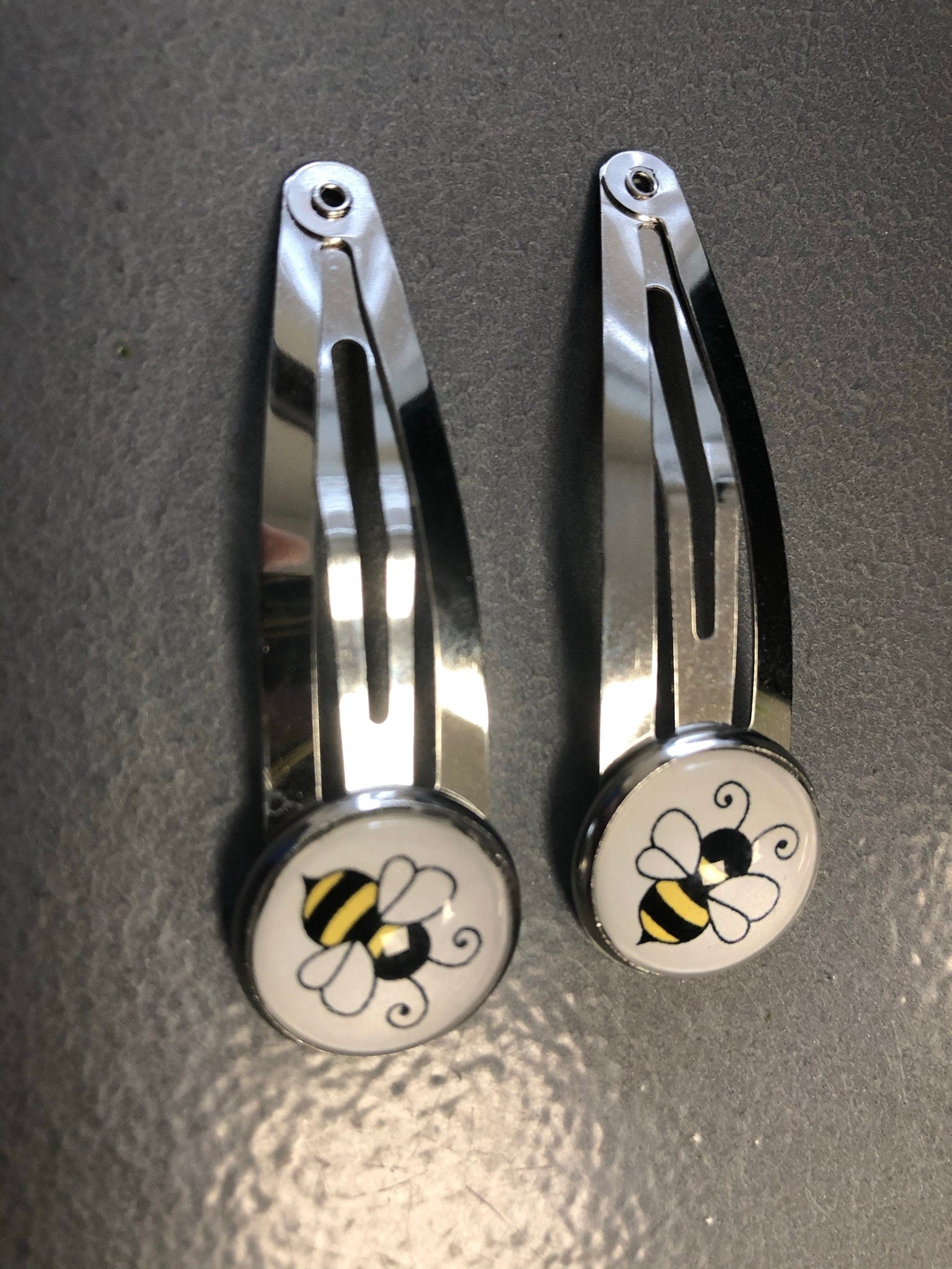 pair of bee hair clips silver tone snap lock closure