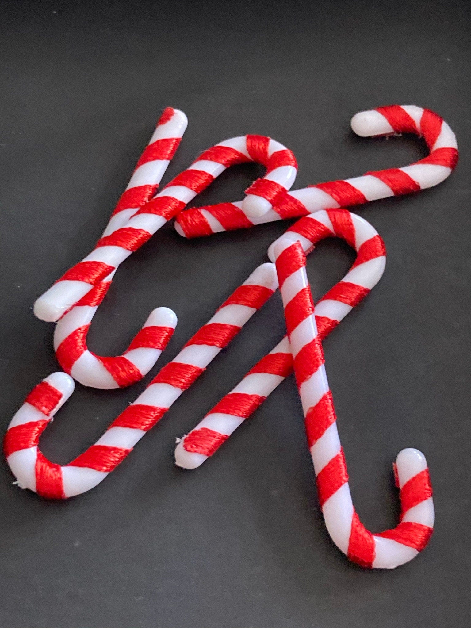 Christmas red and white candy cane cake toppers , 6 x 5cm long plastic and ribbon