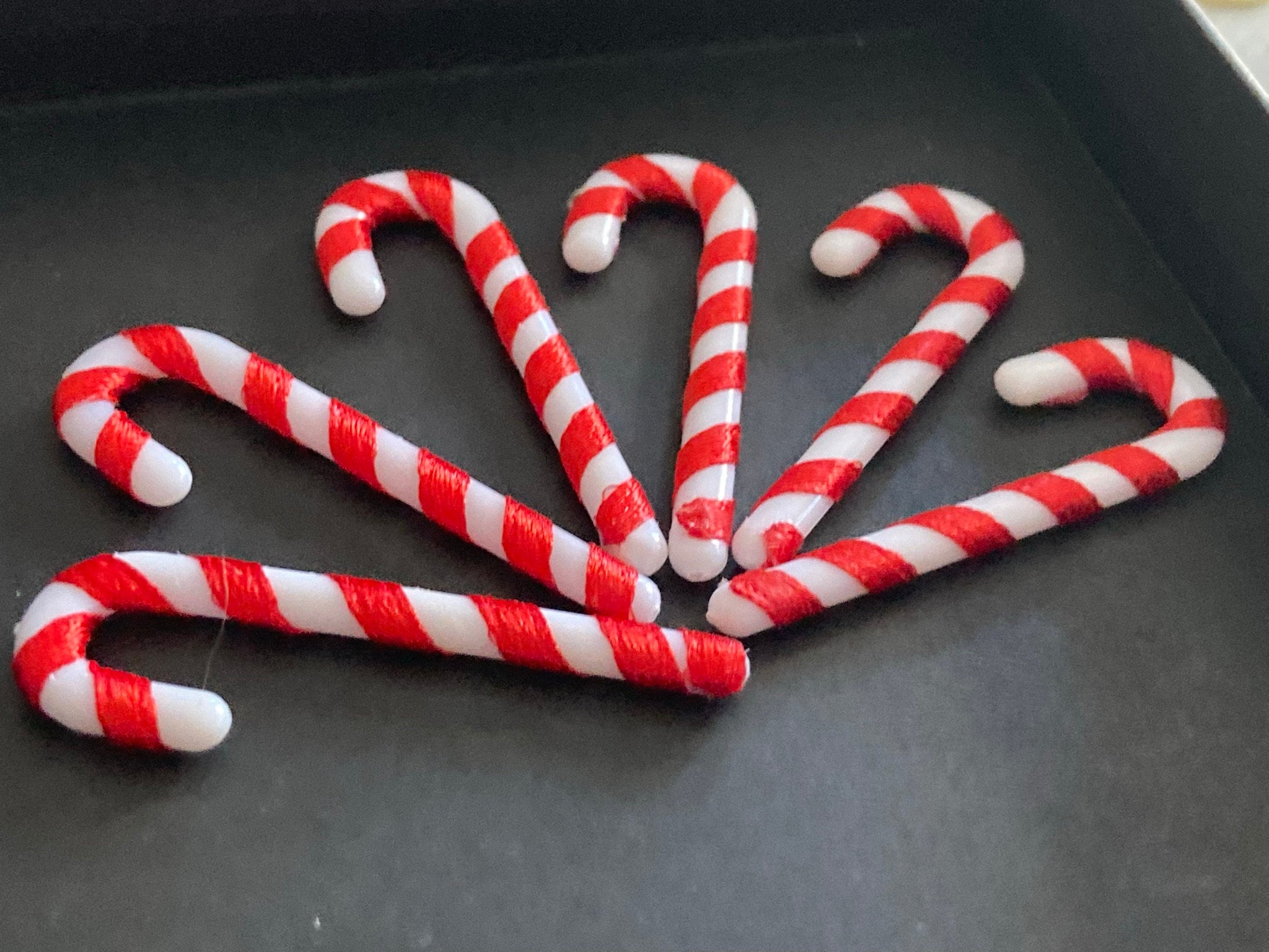 Christmas red and white candy cane cake toppers , 6 x 5cm long plastic and ribbon