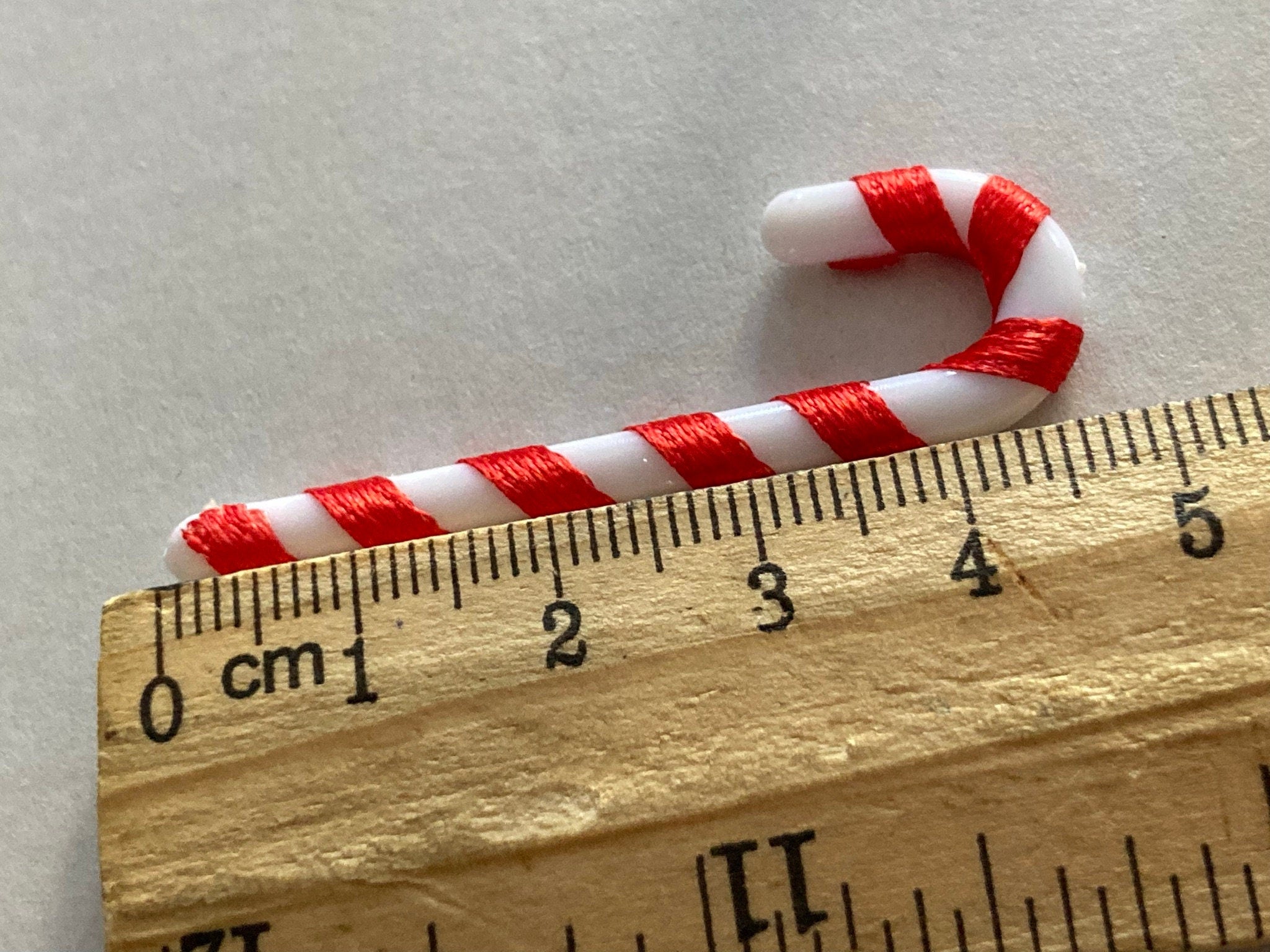 Christmas red and white candy cane cake toppers , 6 x 5cm long plastic and ribbon