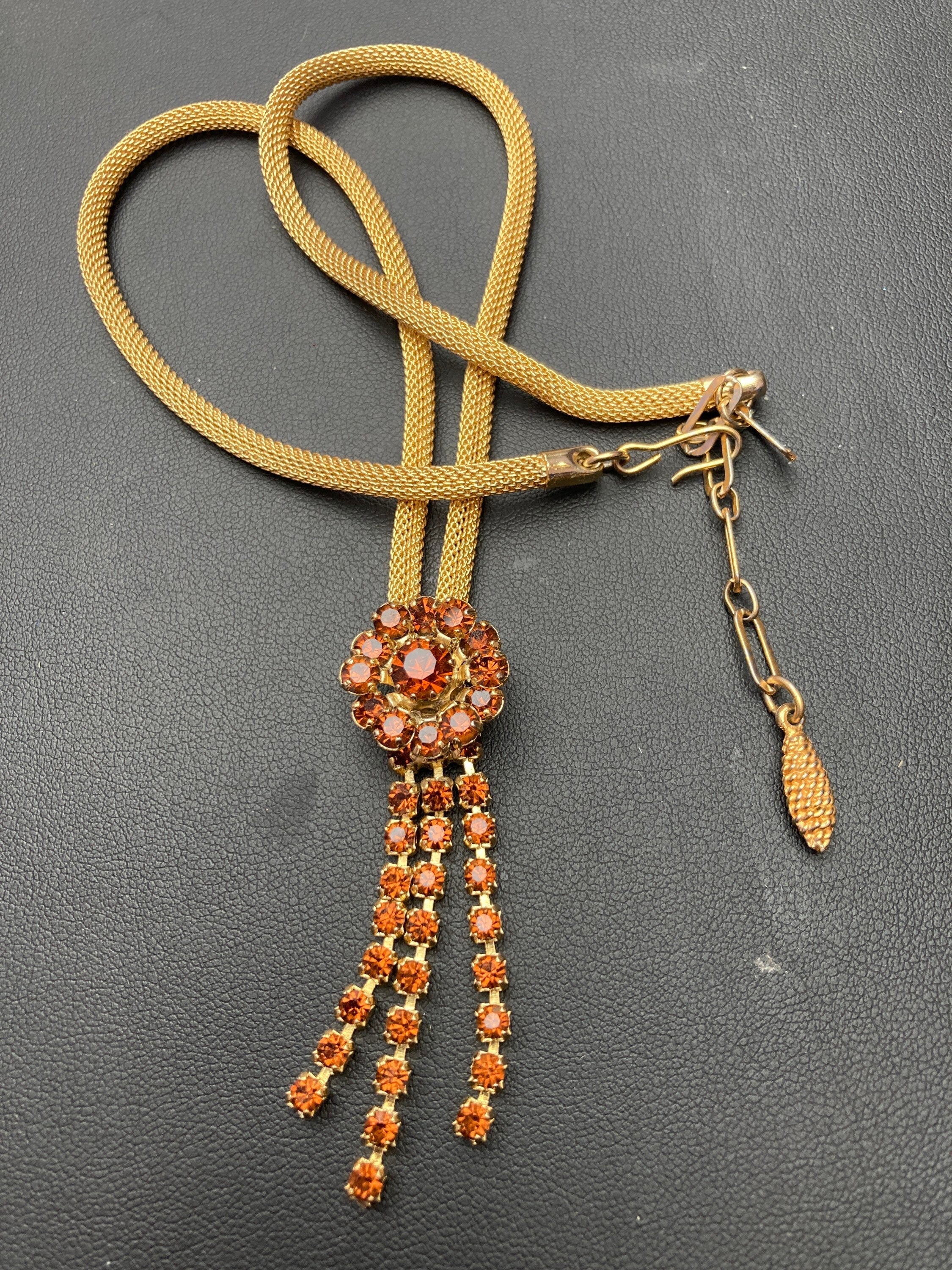Vintage gold tone mesh lariat drop necklace with brown cognac glass paste stones
