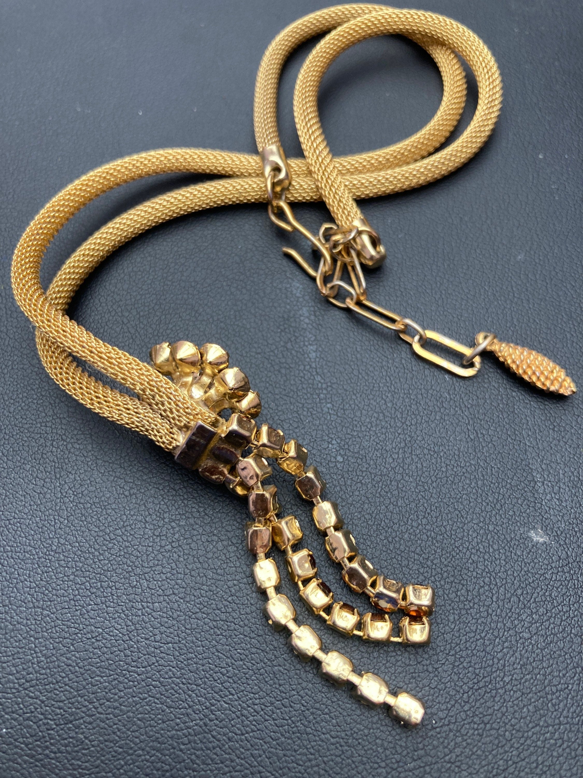 Vintage gold tone mesh lariat drop necklace with brown cognac glass paste stones