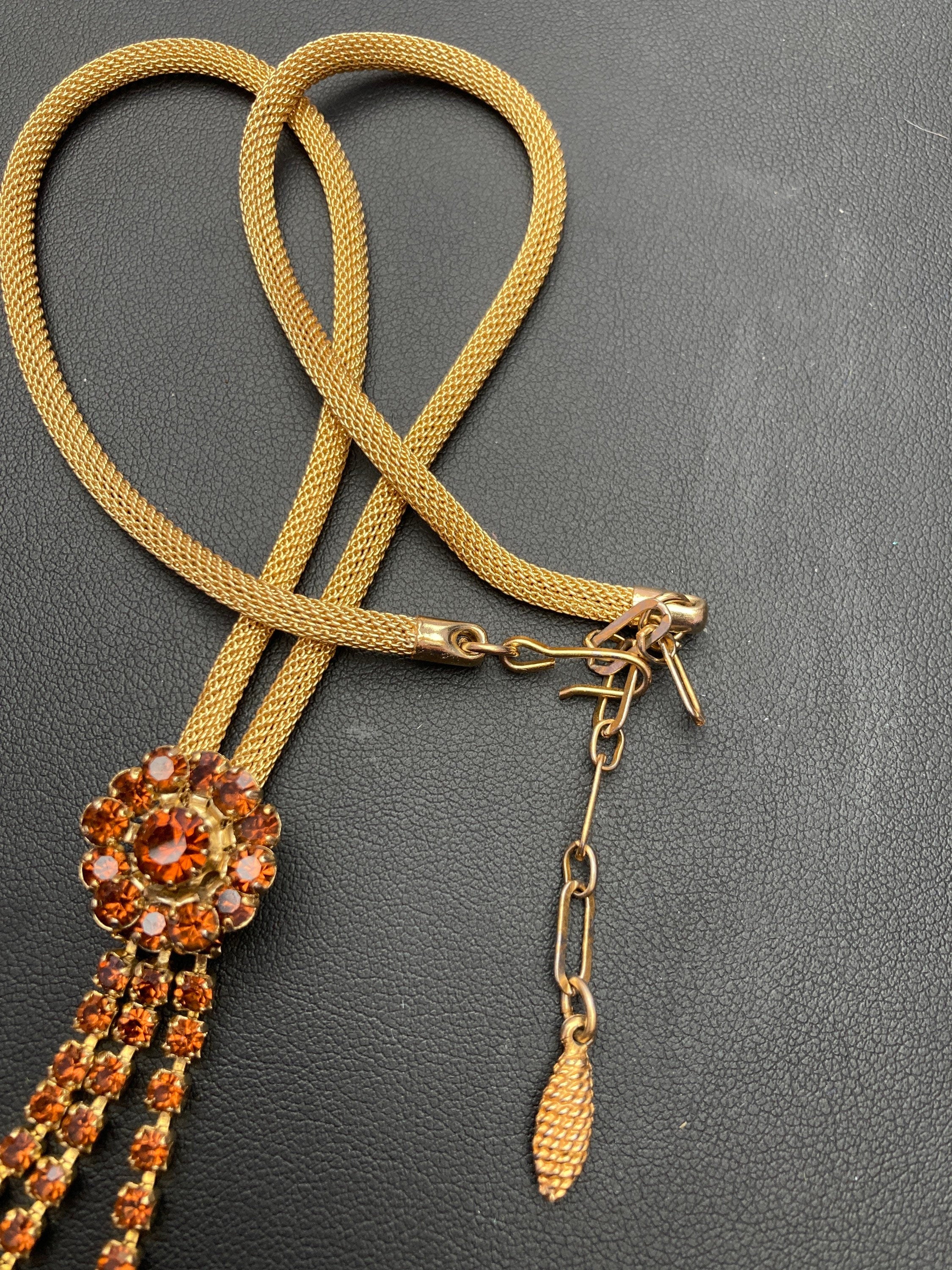 Vintage gold tone mesh lariat drop necklace with brown cognac glass paste stones