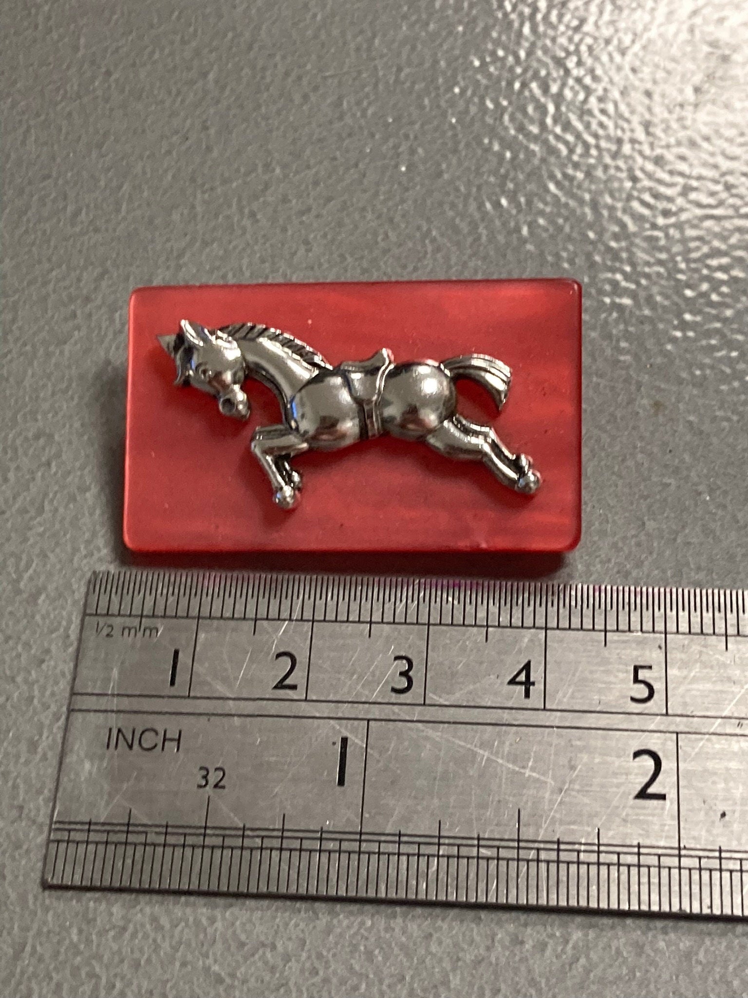 Early Plastic Celluloid Art Deco red resin Silver Horse brooch