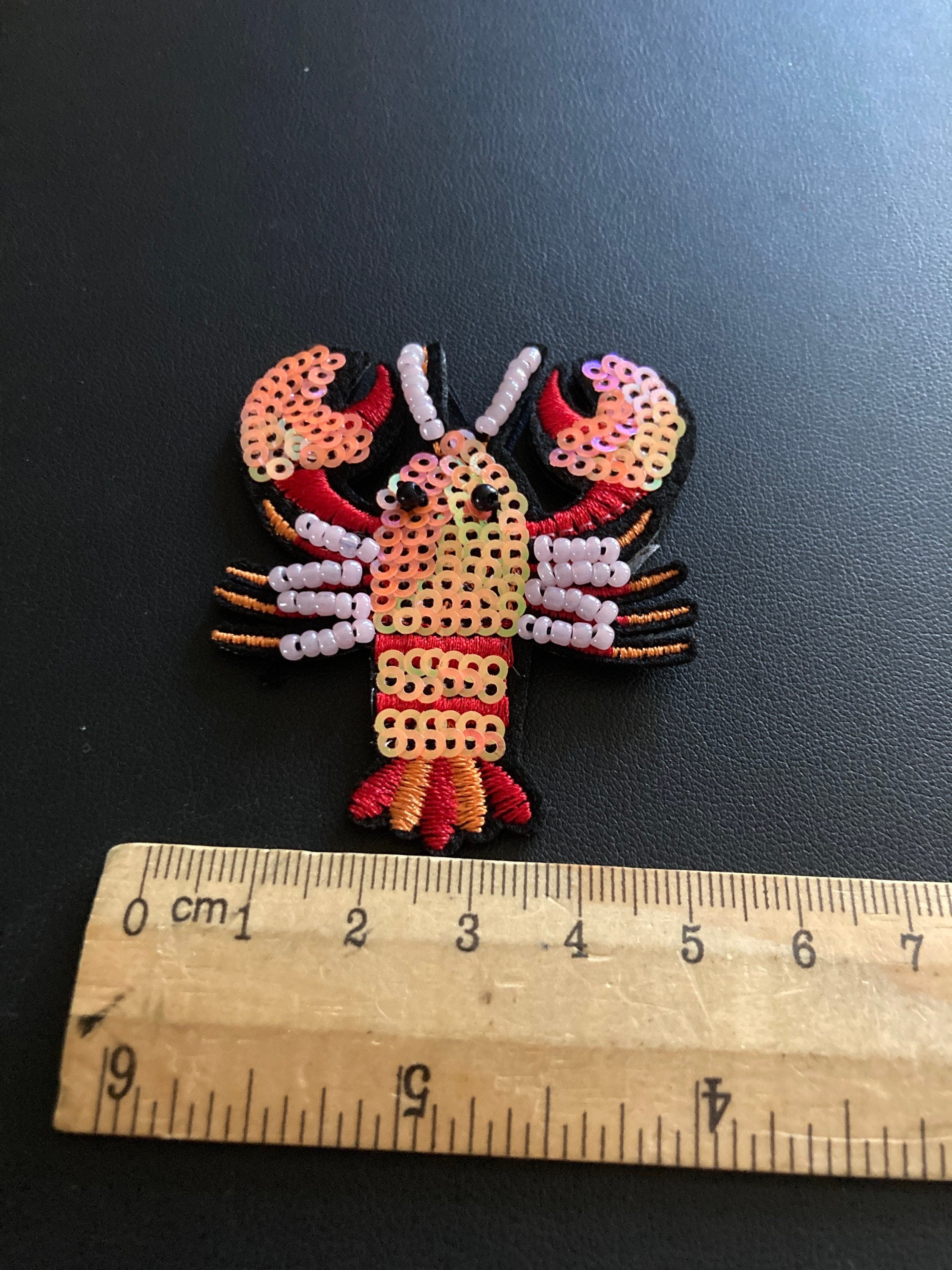 Small iron on lobster patch 6 x 5cm Pearl seed coral sequins