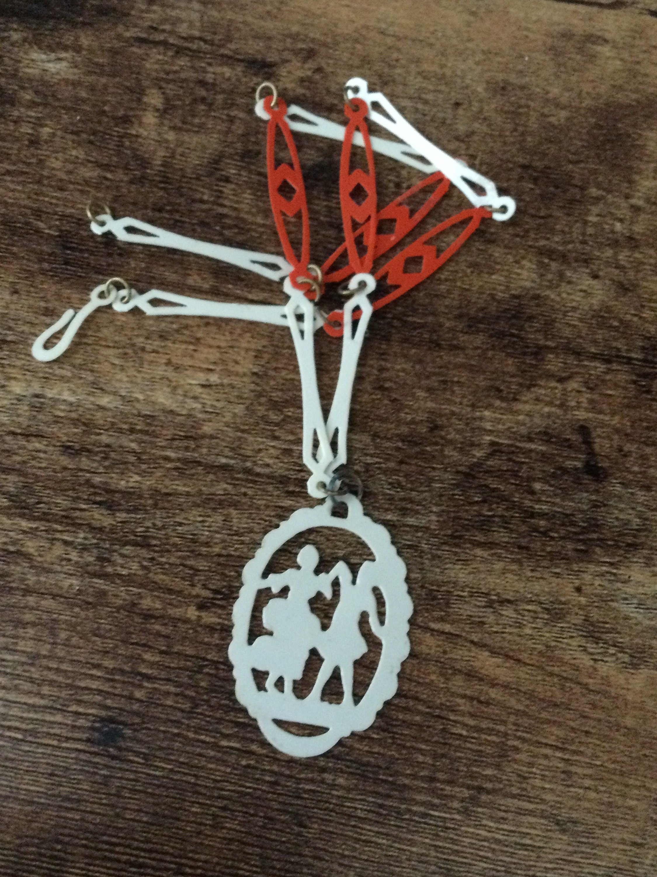 True Art Deco early plastic pendant necklace and chain orange & cream thin celluloid cut out 4cm