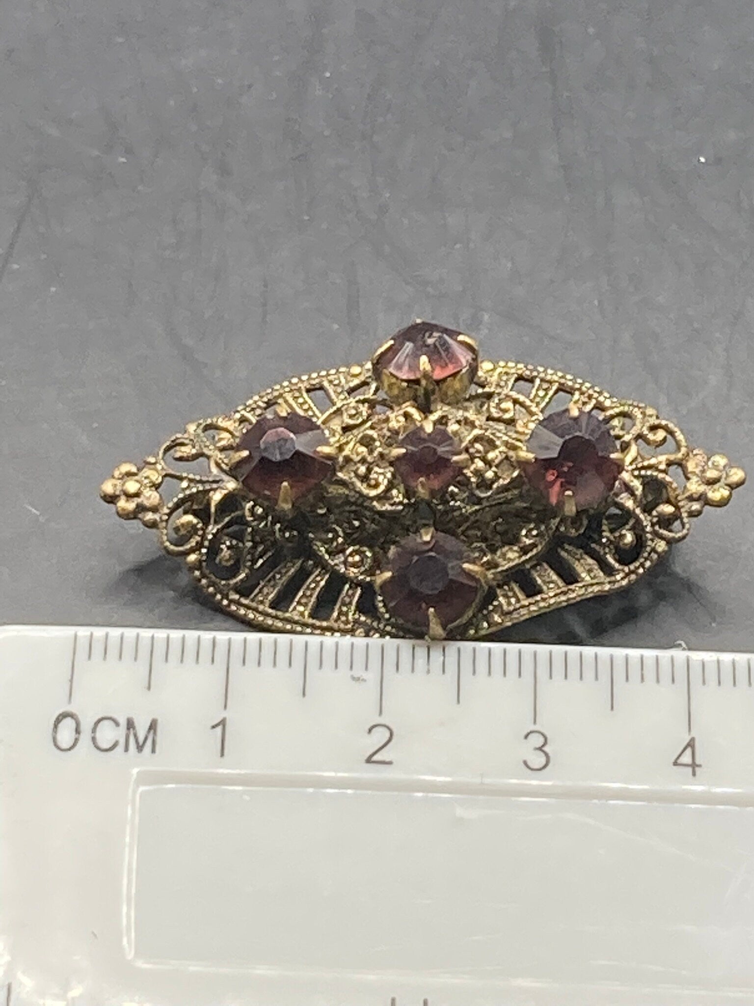 Czech gold tone filigree faux amethyst purple rhinestone brooch
