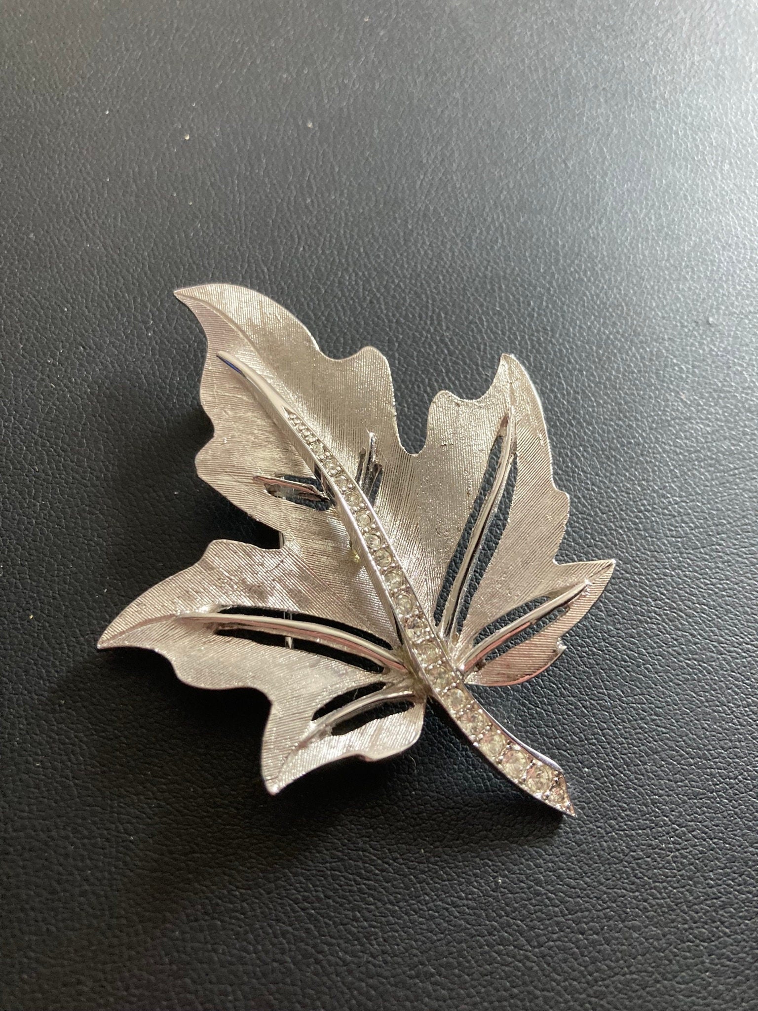 HOLLYWOOD signed silver diamanté paste maple leaf brooch