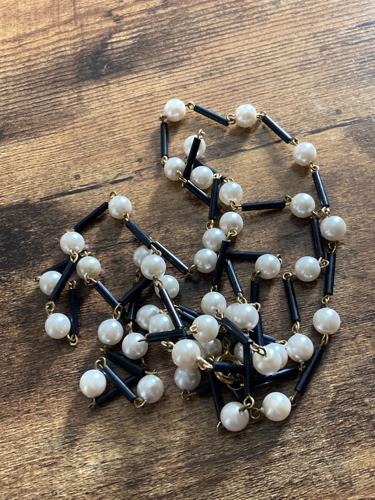 Flapper length MCM cream plastic pearl necklace with black glass bugle beads