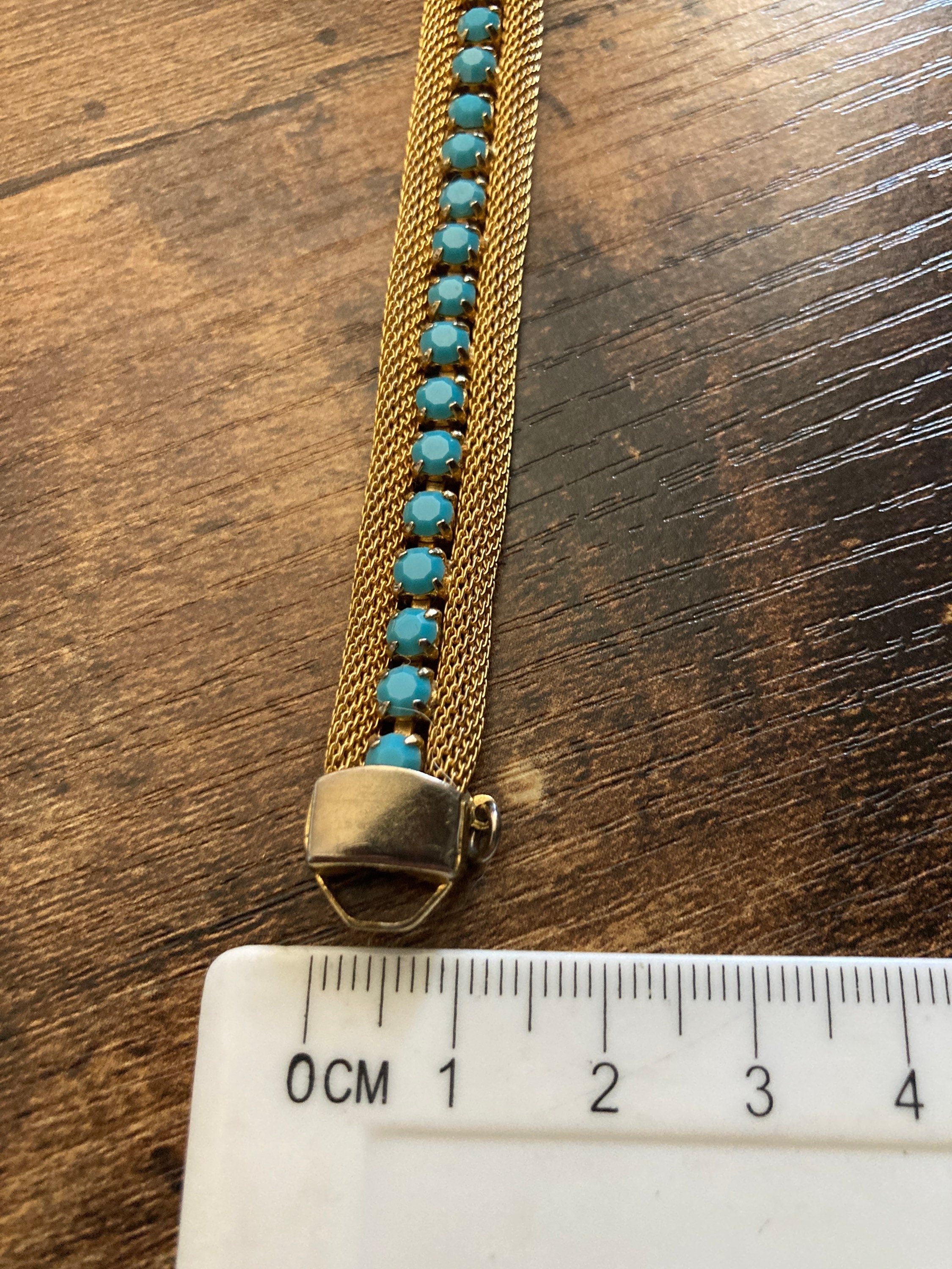 Vintage gold tone cuff bracelet with turquoise blue paste