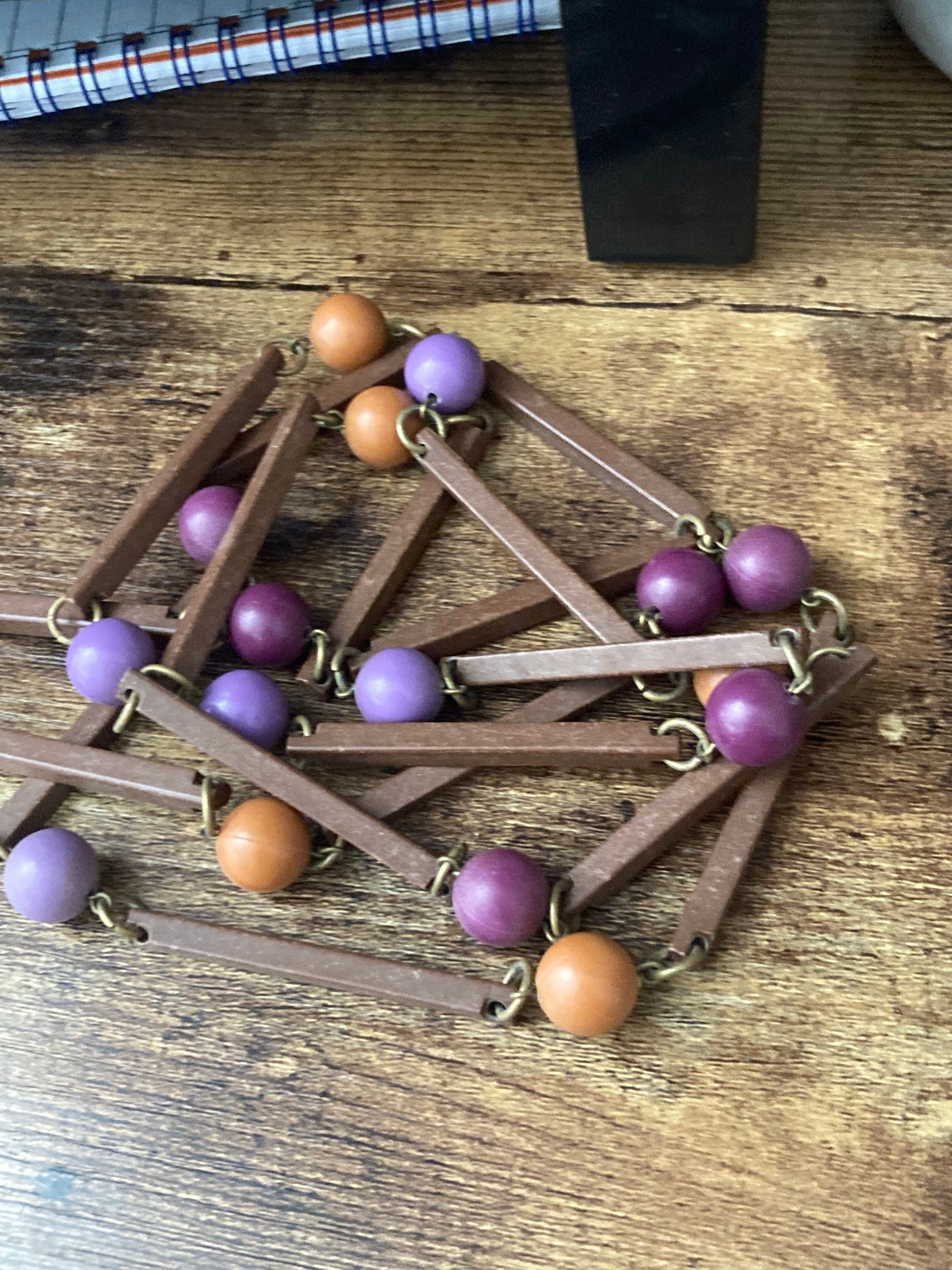 Vintage purple beige orange and brown flapper length plastic and wooden beaded necklace 125cm long