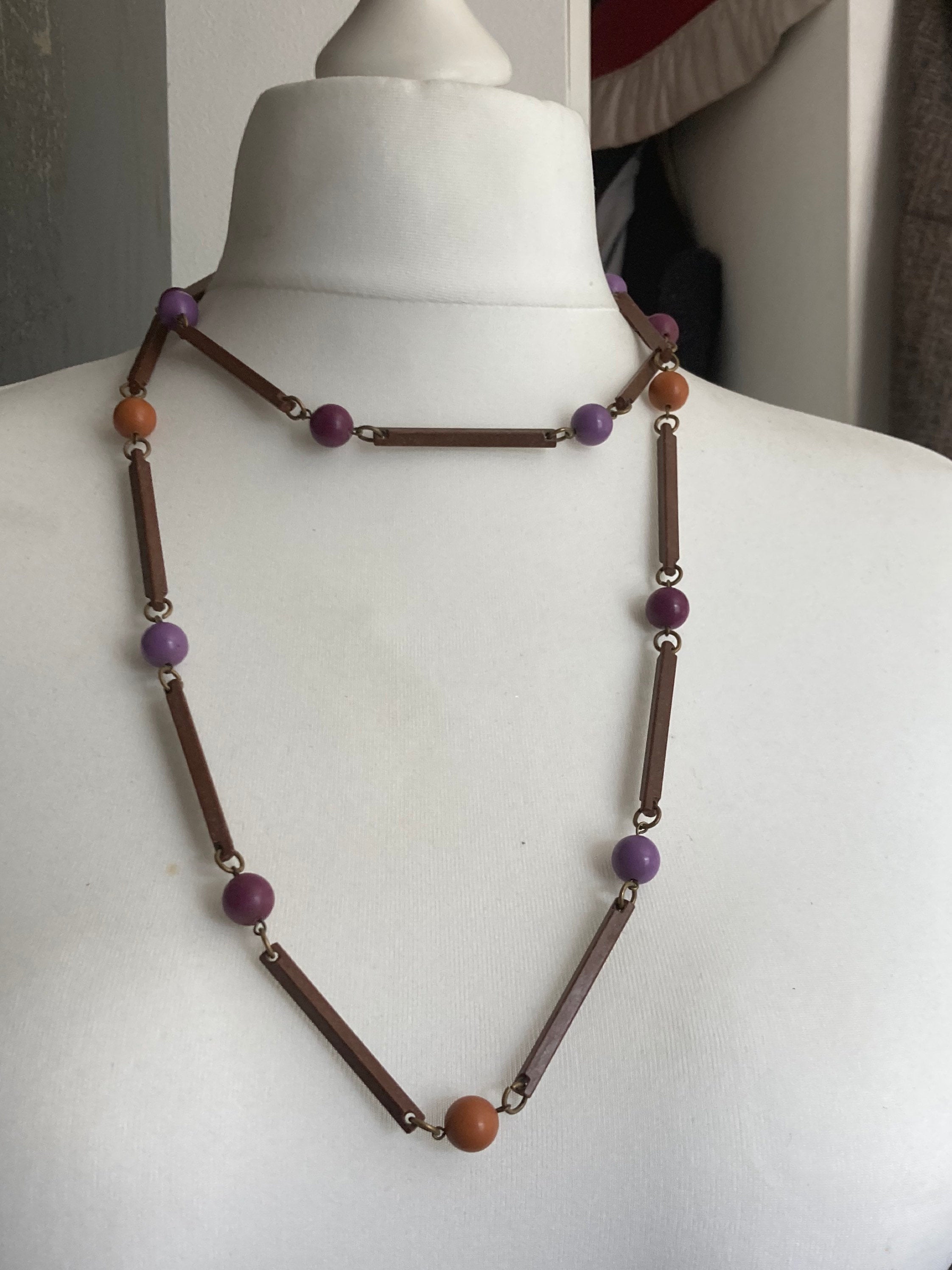 Vintage purple beige orange and brown flapper length plastic and wooden beaded necklace 125cm long