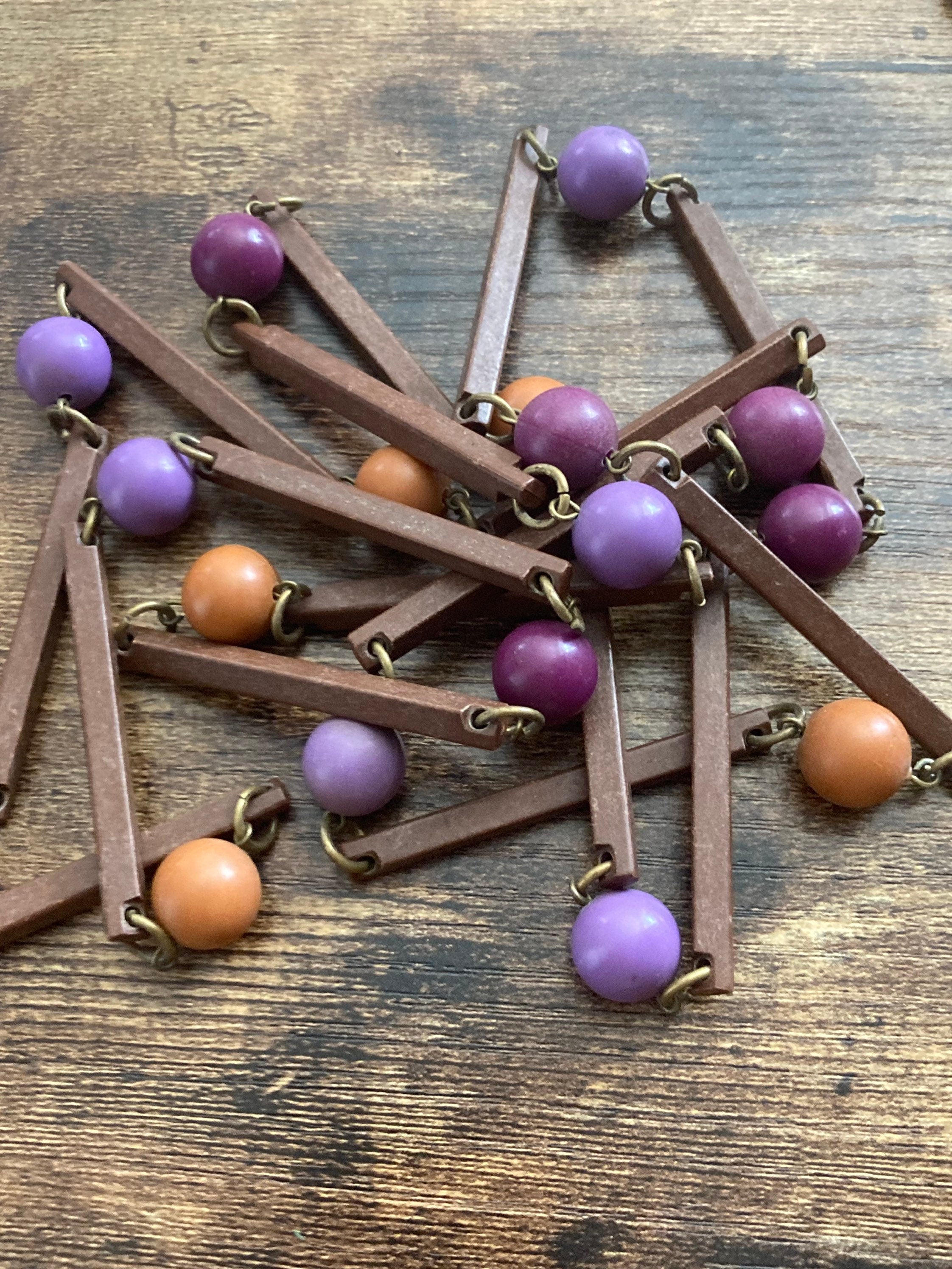 Vintage purple beige orange and brown flapper length plastic and wooden beaded necklace 125cm long