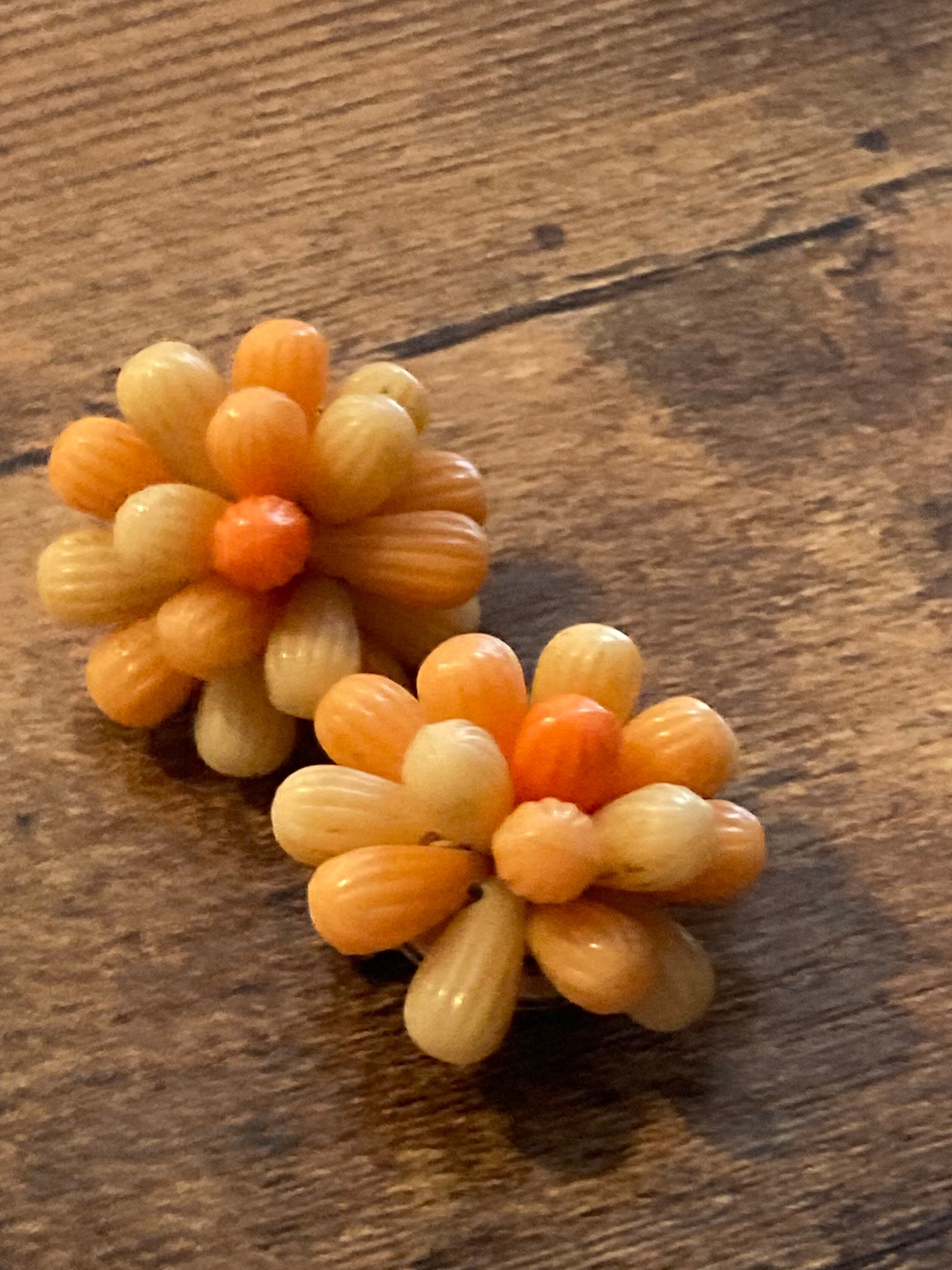Vintage 1950s bright tangerine orange floral plastic beaded Cluster Clip On Earrings