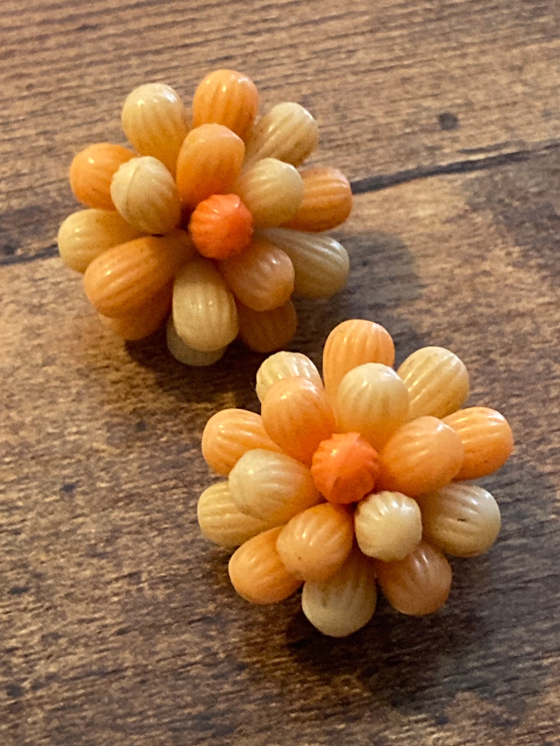 Vintage 1950s bright tangerine orange floral plastic beaded Cluster Clip On Earrings