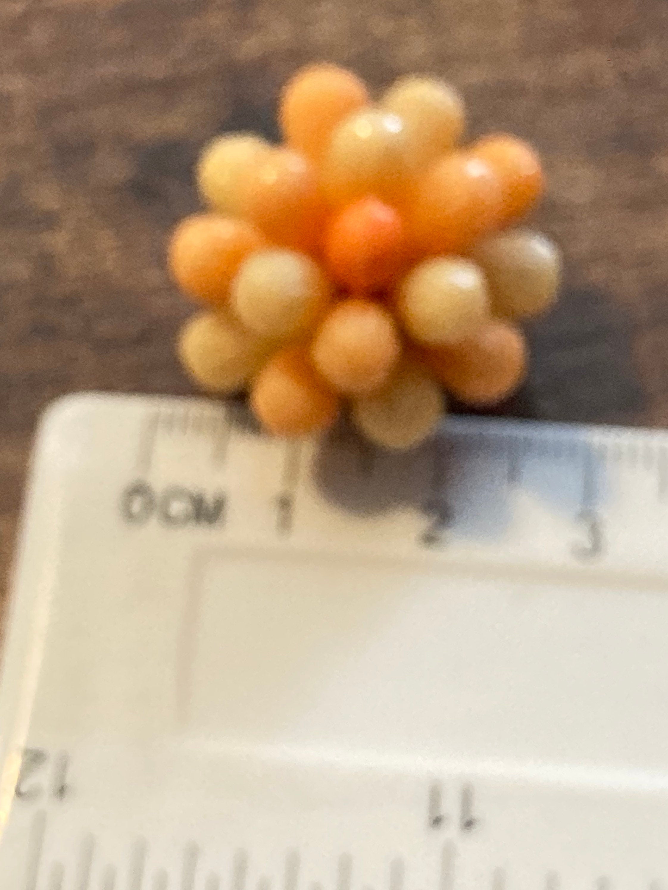 Vintage 1950s bright tangerine orange floral plastic beaded Cluster Clip On Earrings