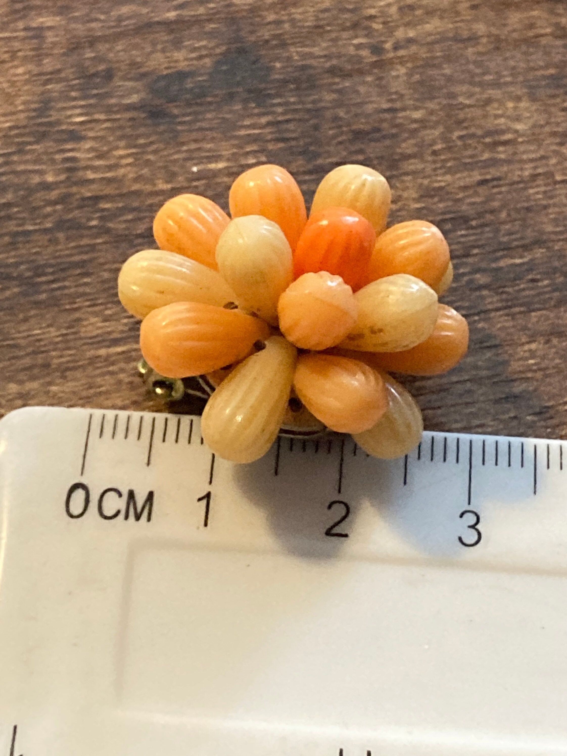 Vintage 1950s bright tangerine orange floral plastic beaded Cluster Clip On Earrings