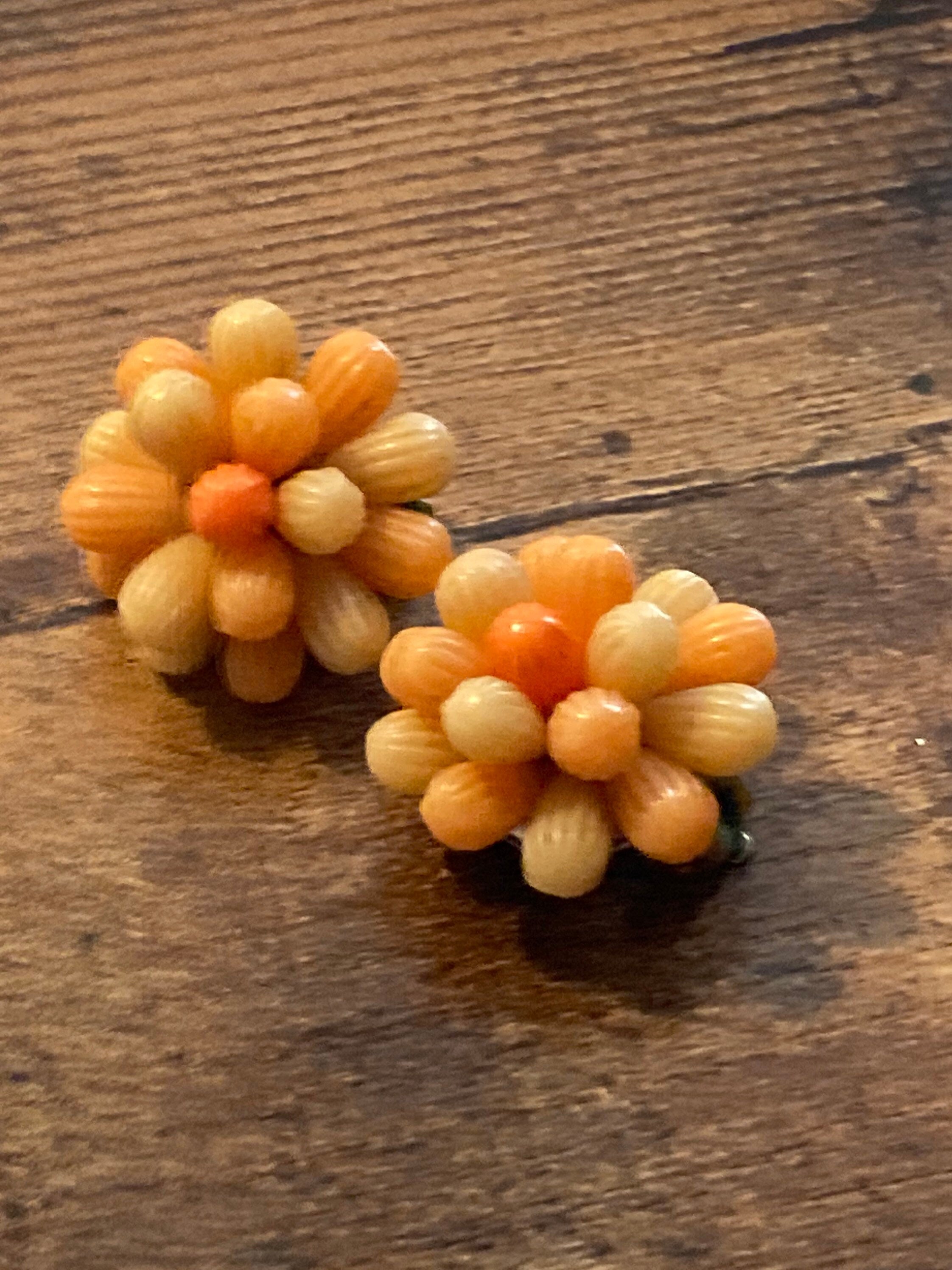 Vintage 1950s bright tangerine orange floral plastic beaded Cluster Clip On Earrings