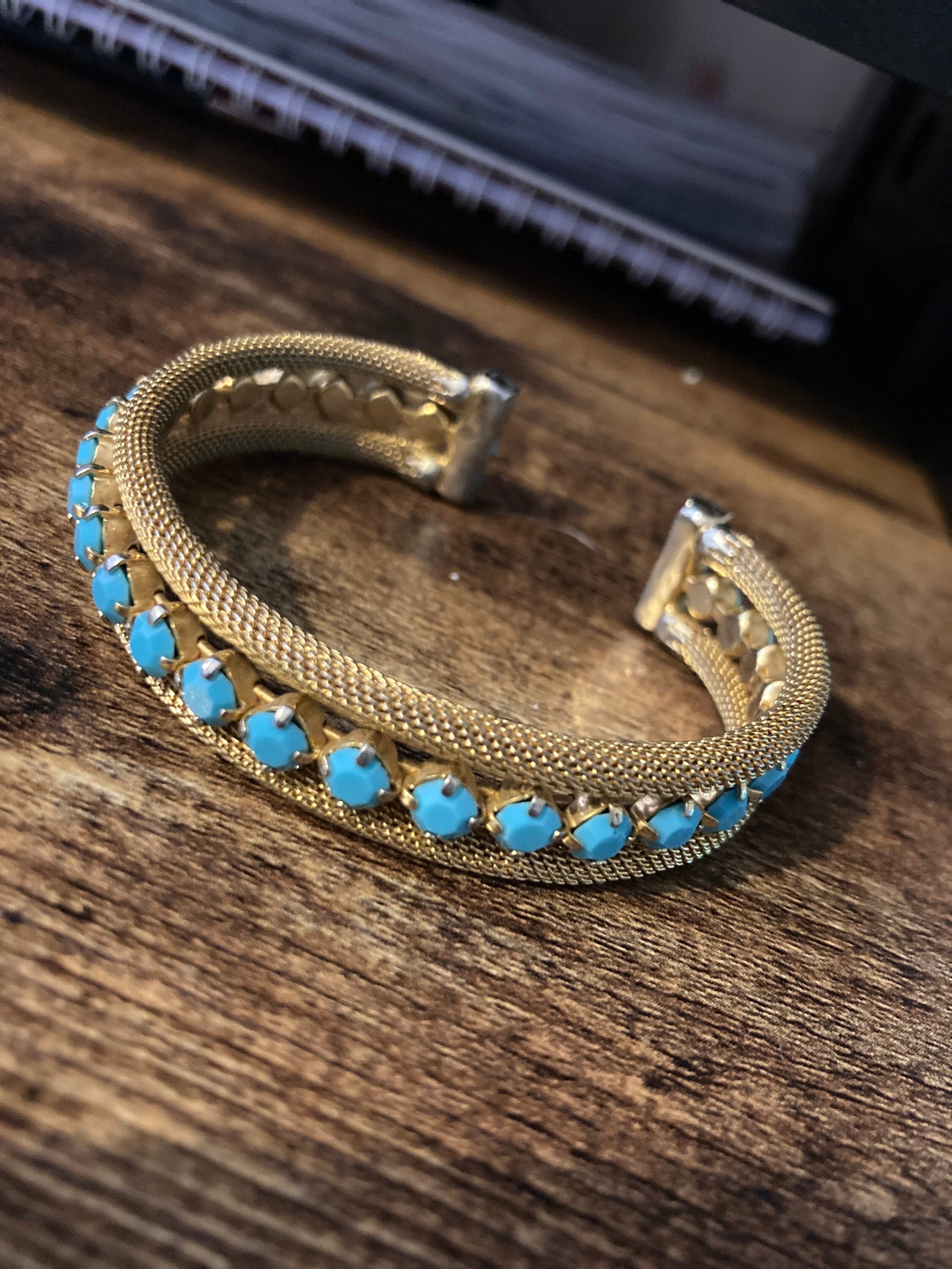 gold tone mesh cuff bracelet with turquoise blue paste
