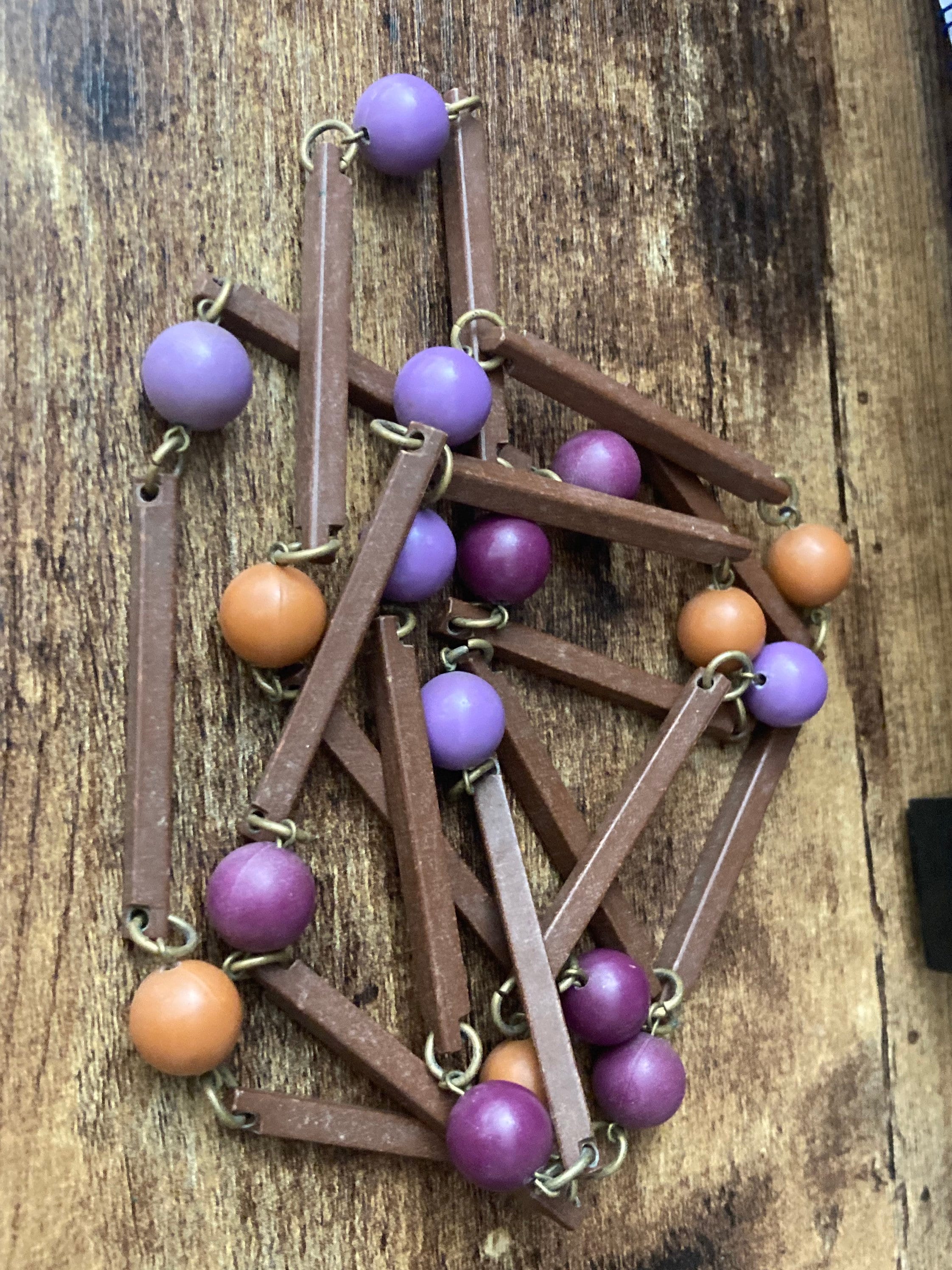 Vintage purple beige orange and brown flapper length plastic and wooden beaded necklace 125cm long