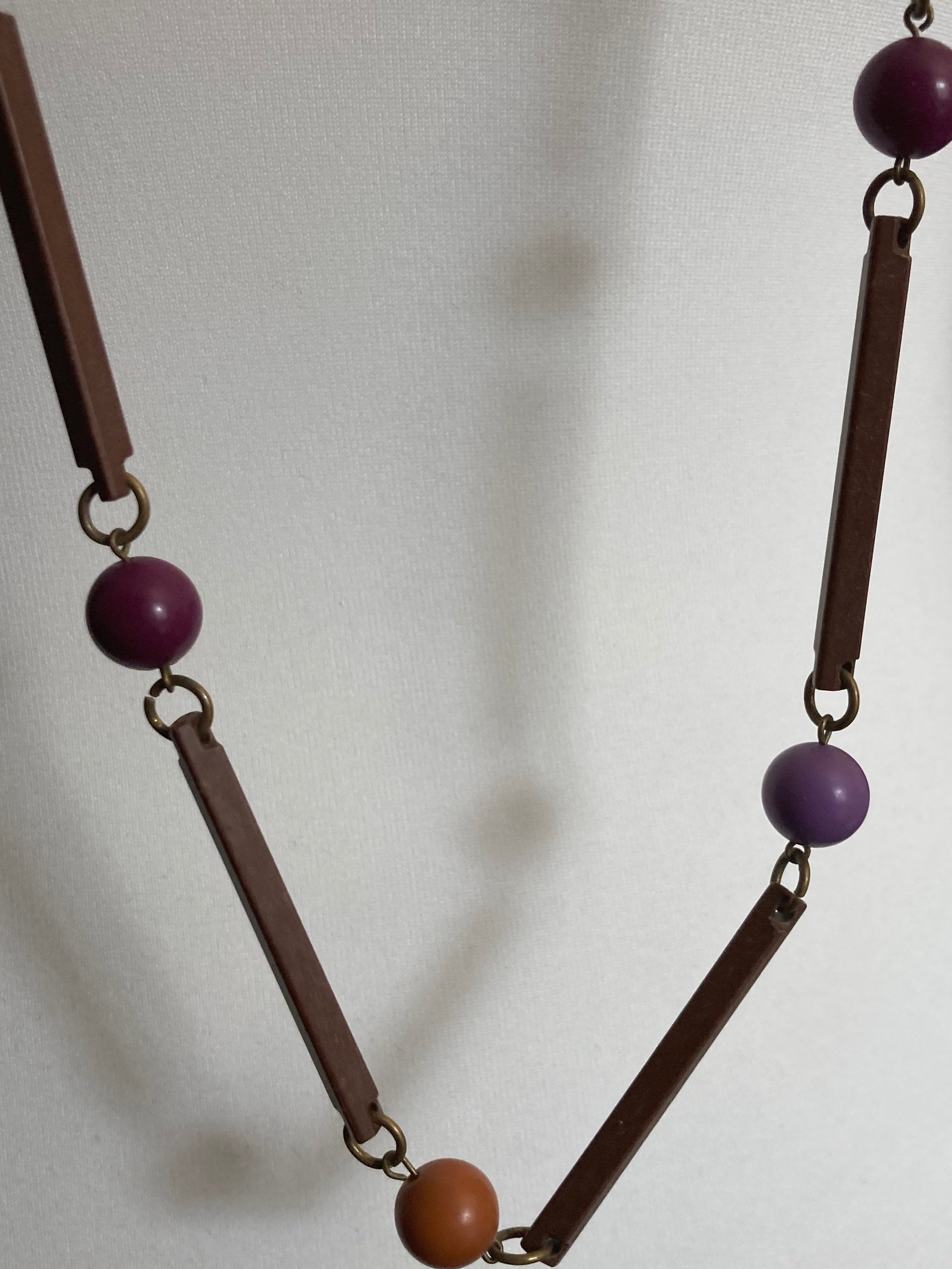 Vintage purple beige orange and brown flapper length plastic and wooden beaded necklace 125cm long