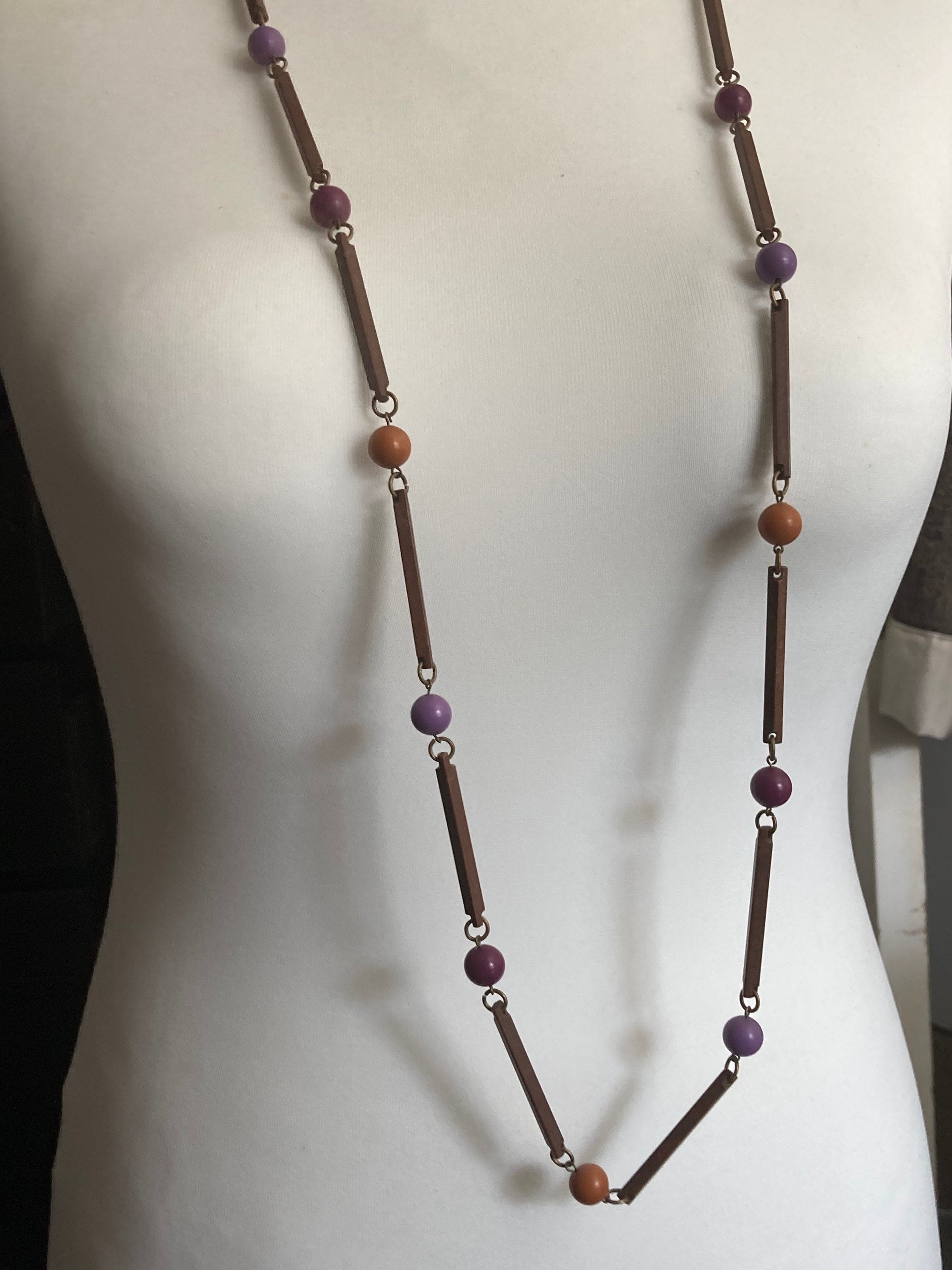 Vintage purple beige orange and brown flapper length plastic and wooden beaded necklace 125cm long