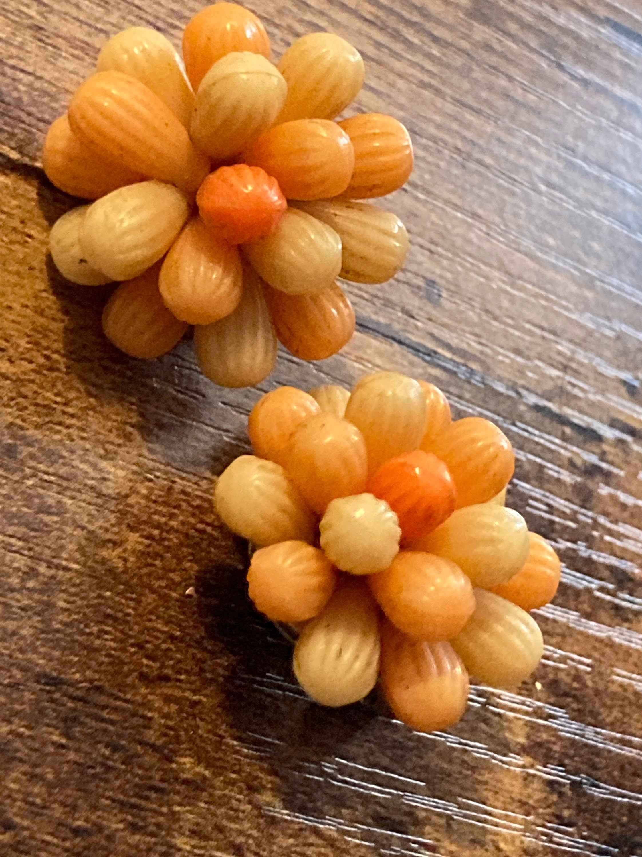 Vintage 1950s bright tangerine orange floral plastic beaded Cluster Clip On Earrings