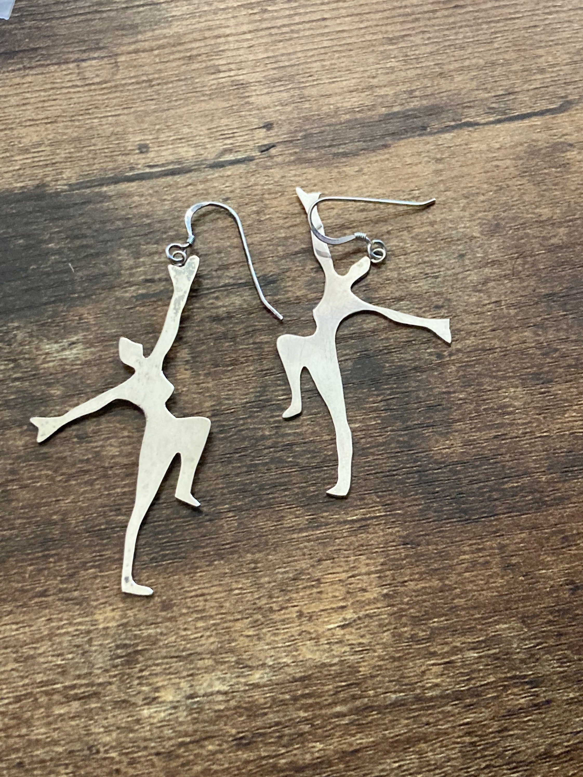 Unmarked silver 7cm long Art Deco dancing lady drop earrings pierced ears white metal
