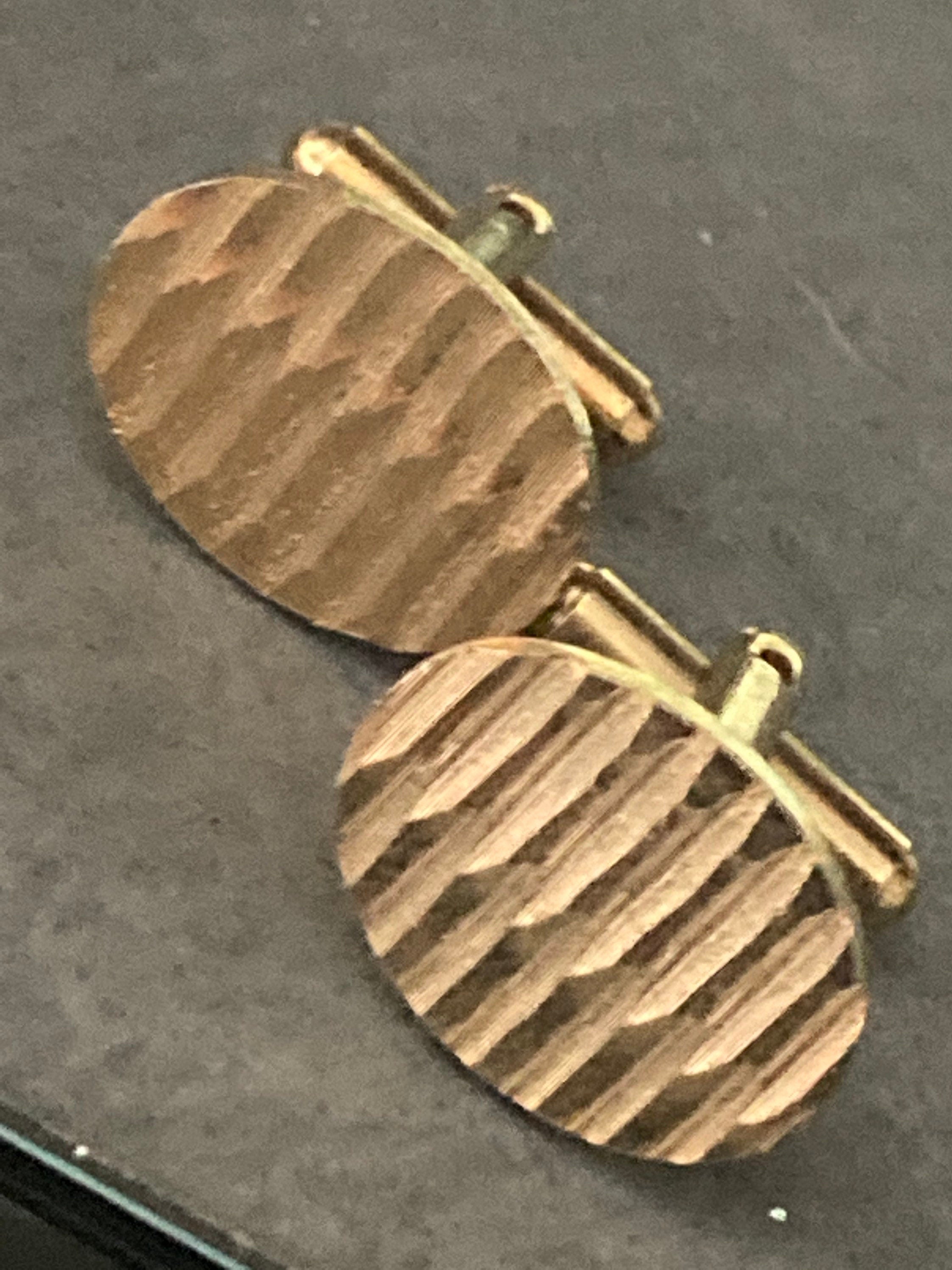 modernist men’s gold tone oval textured plain cufflinks