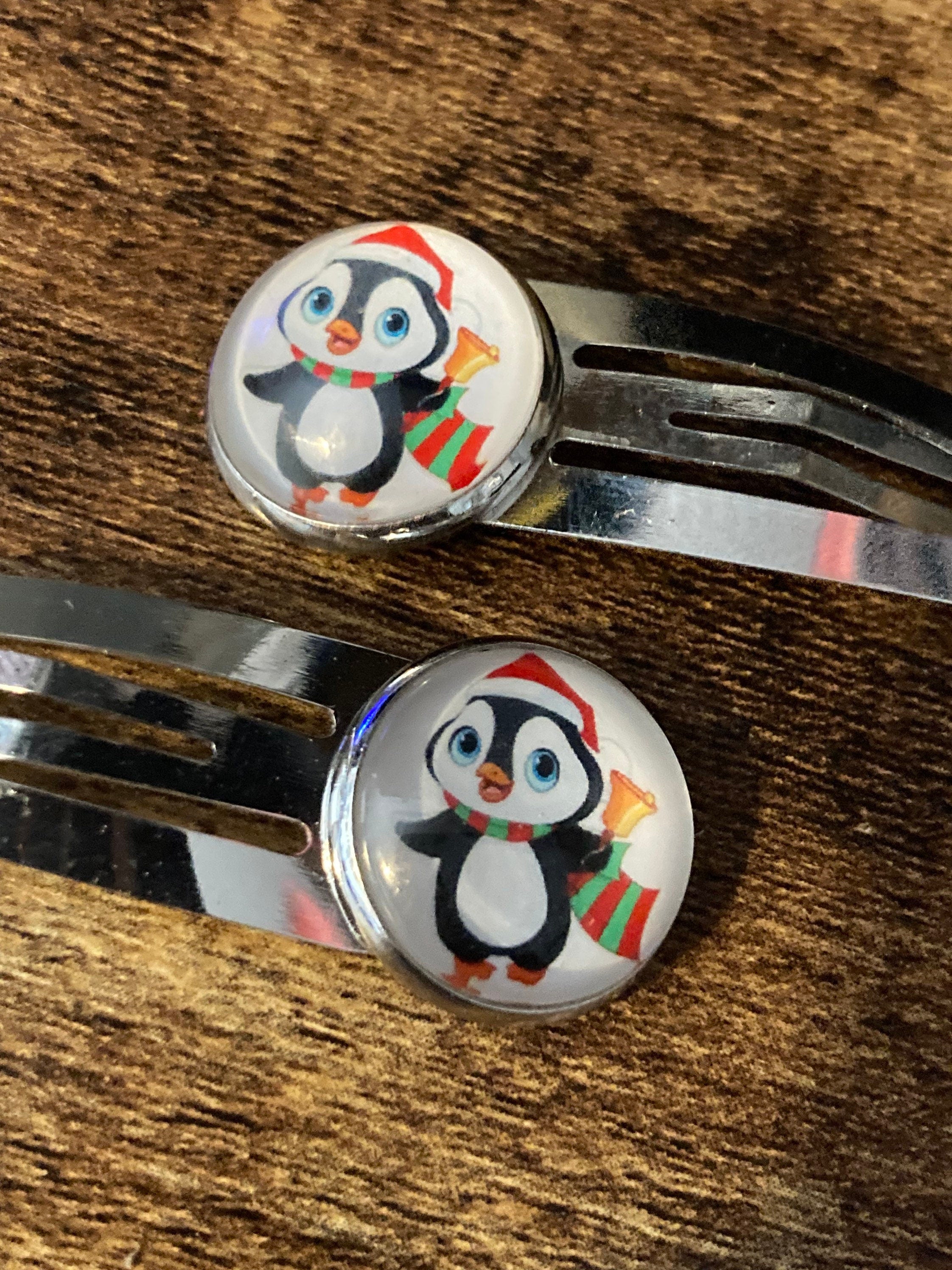 Pair of silver Christmas penguins hair slides
