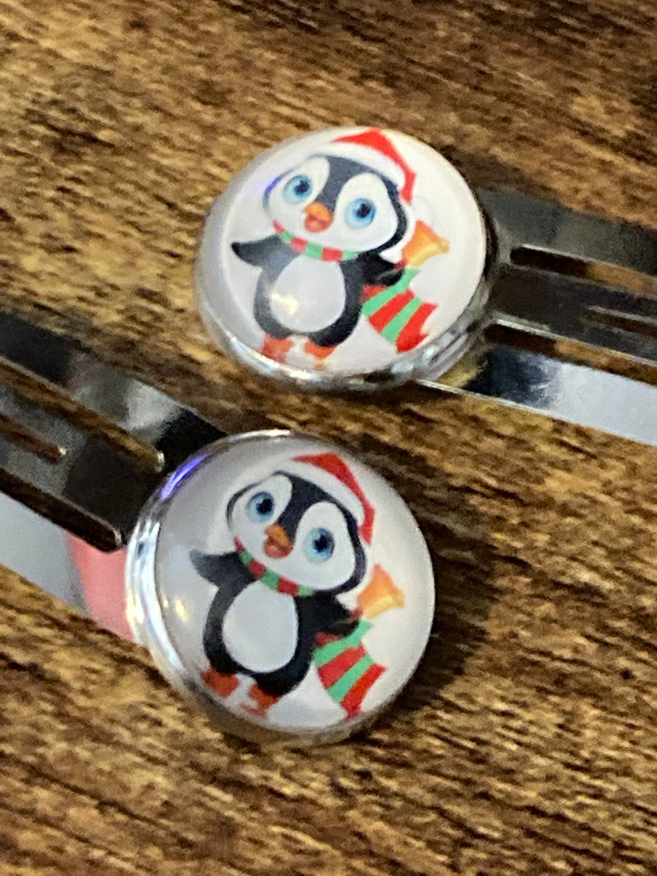 Pair of silver Christmas penguins hair slides