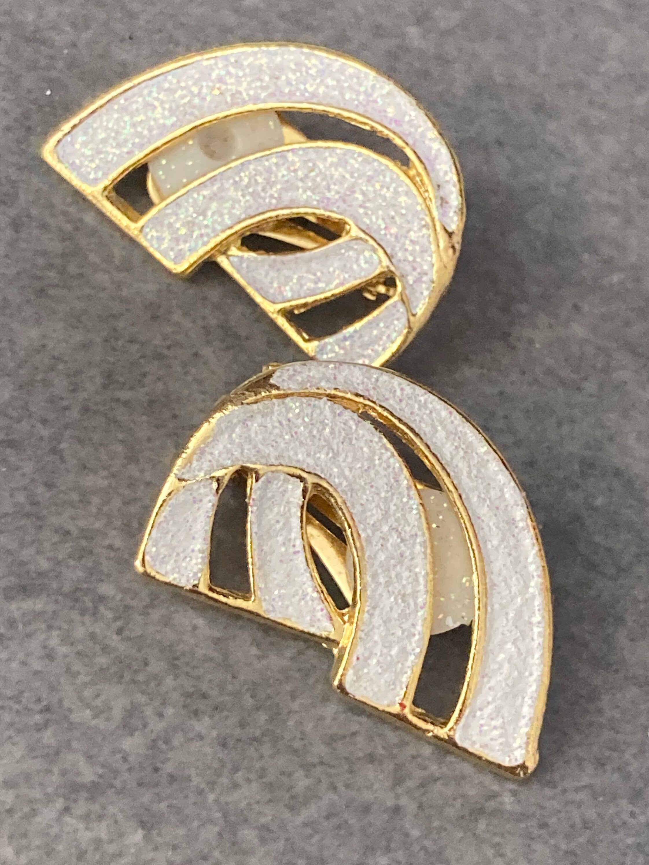 Vintage 1980s large gold tone abstract white glitter clip on earrings