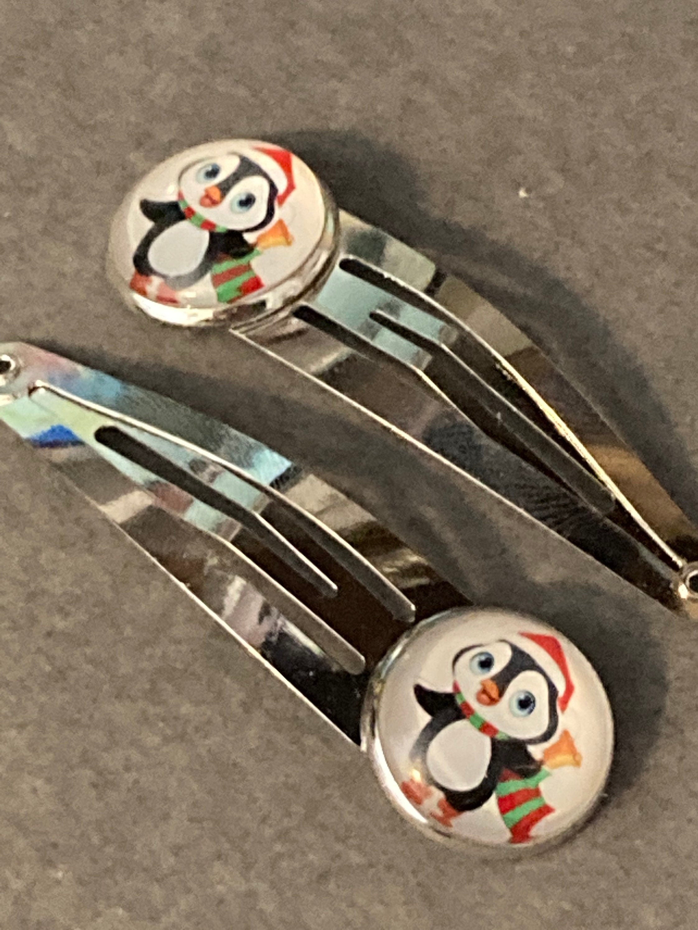 Pair of silver Christmas penguins hair slides
