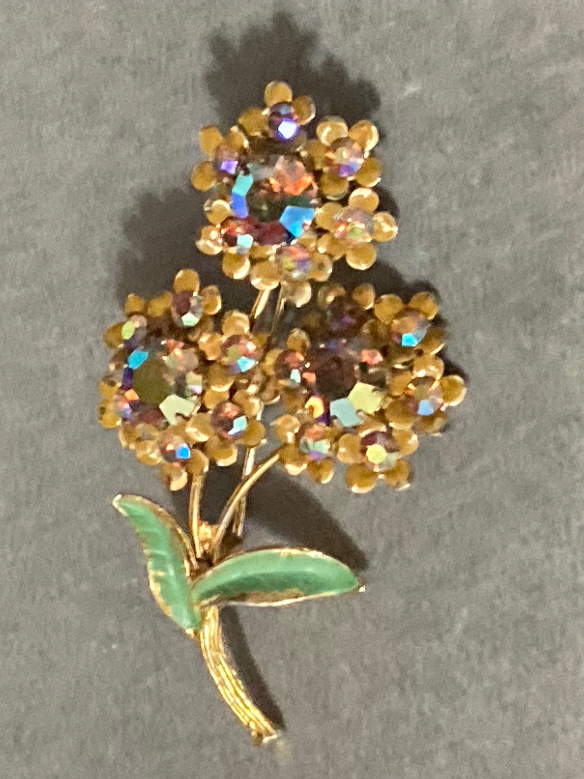 Vintage Aurora Borealis Rhinestone Flower Brooch: Gold Tone Enamel Leaves